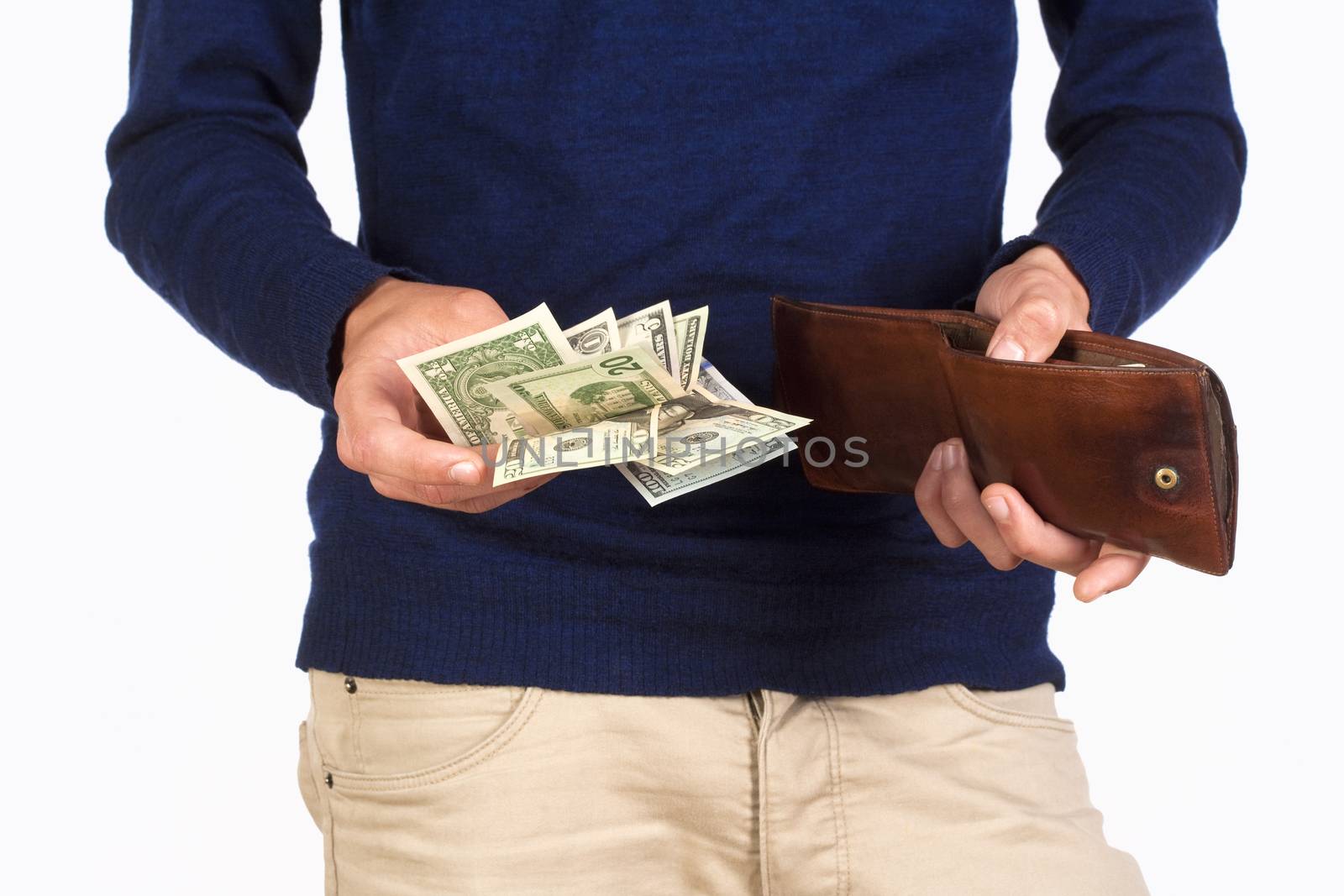 Man Holding a Wallet and Counting Dollar Bills