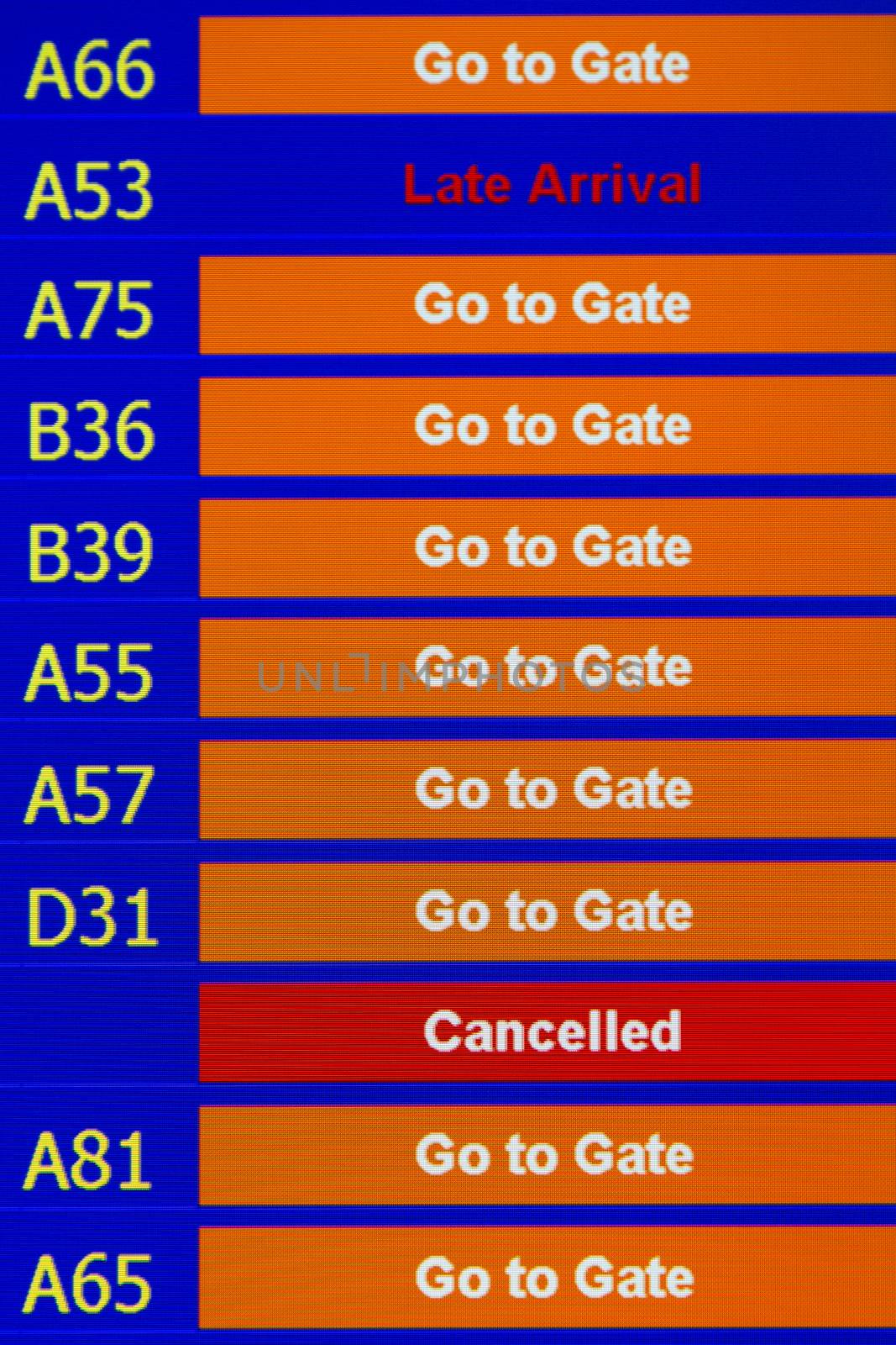 Airport departure board in terminal with flight information