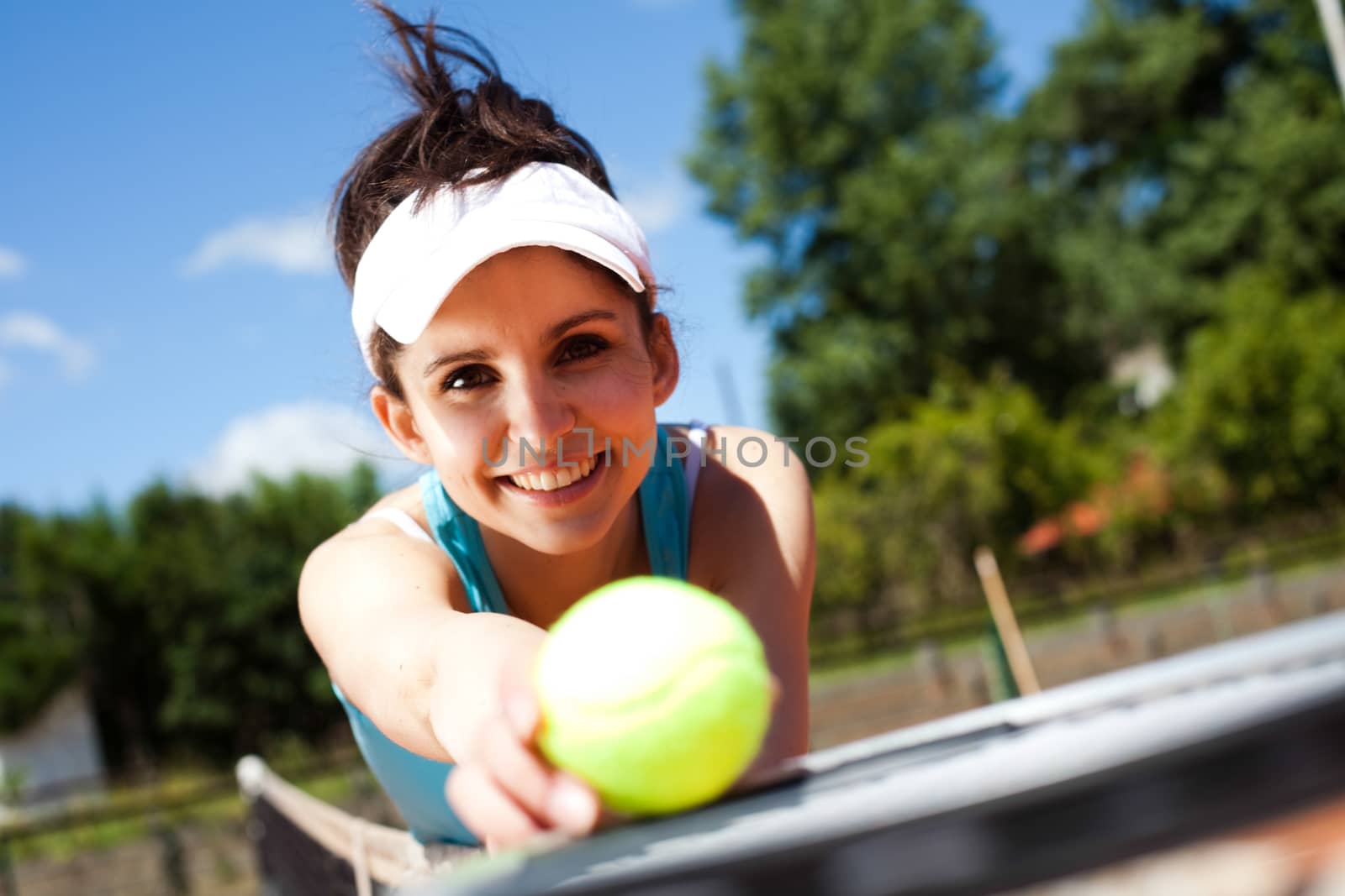 Woman playing tennis, summertime saturated theme by JanPietruszka