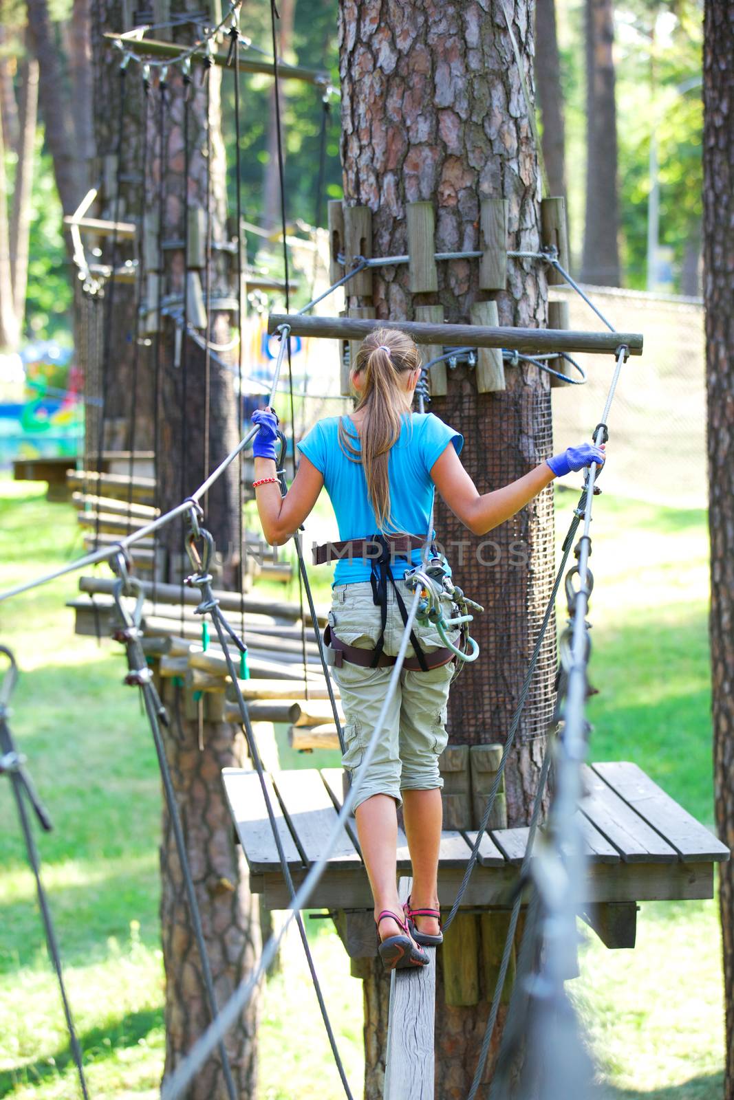 Girl in a climbing adventure park by maxoliki