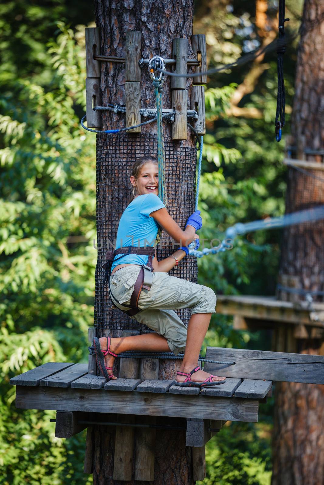 Girl in a climbing adventure park by maxoliki