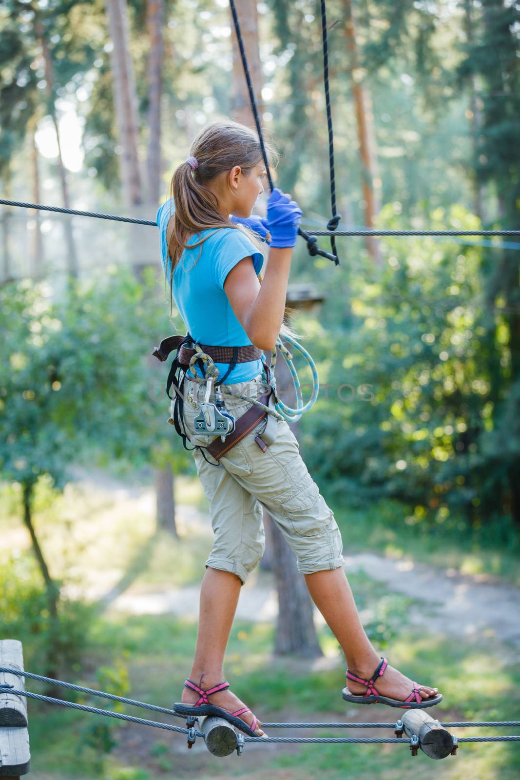 Girl in a climbing adventure park by maxoliki