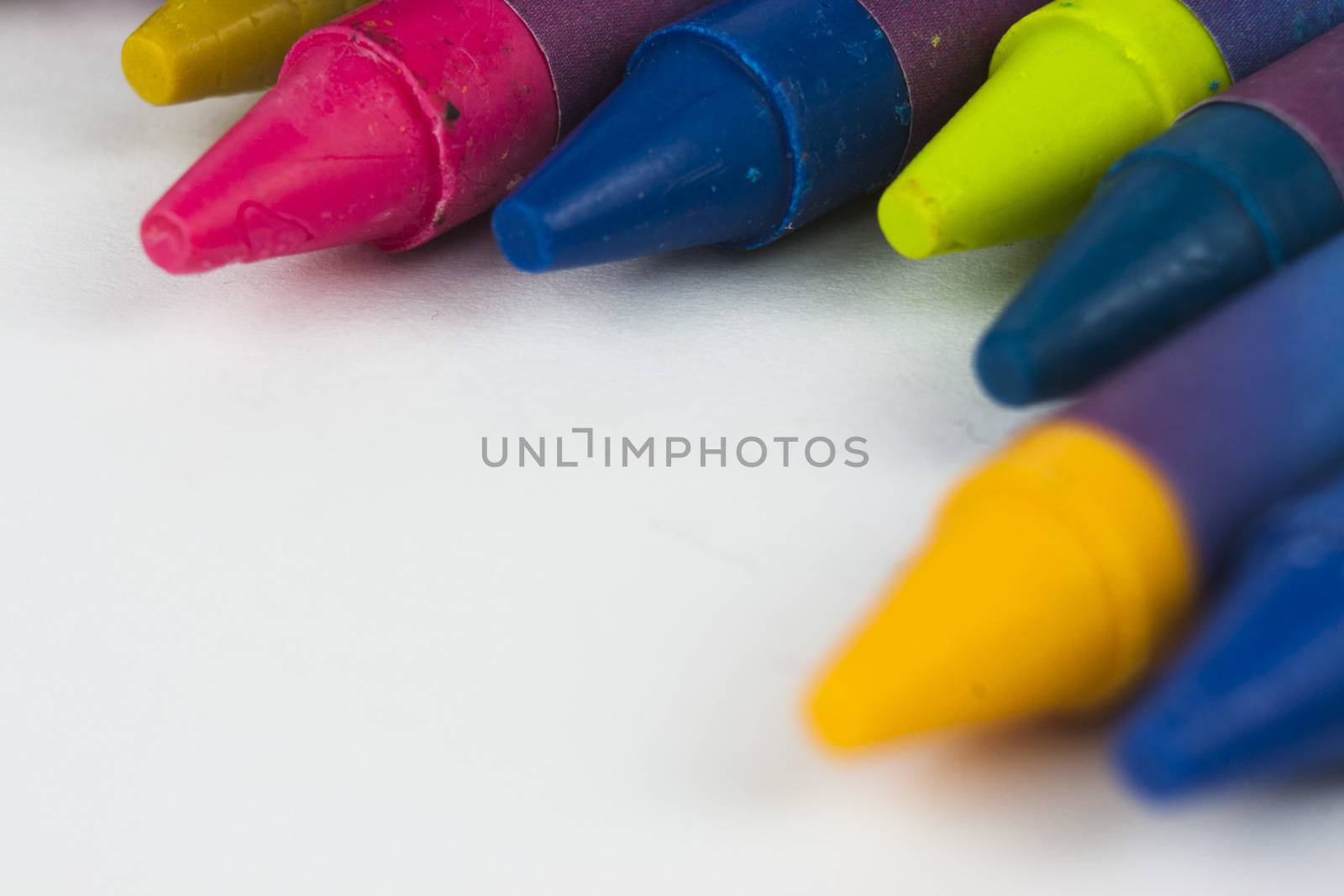 Close up of different coloured crayons