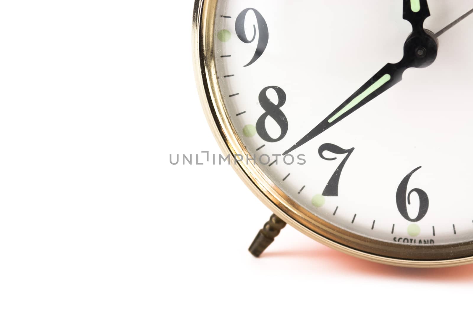 Close up of an alarm clock on a white background