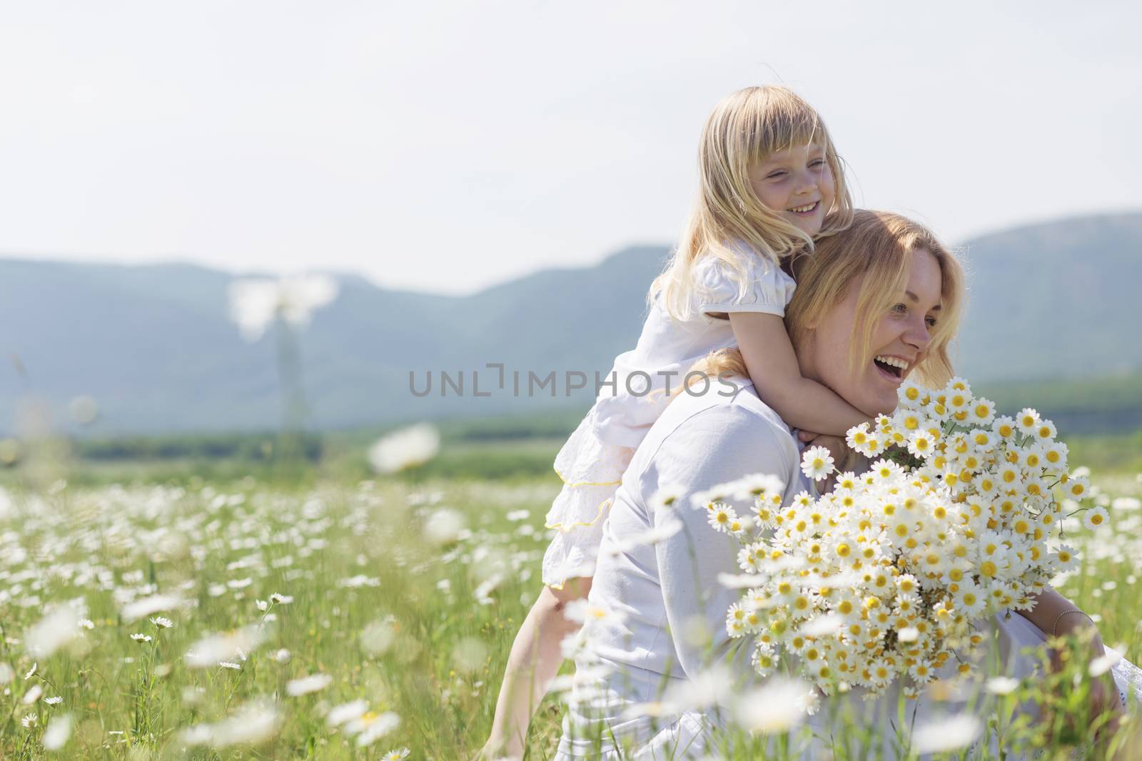 Family in the flower field by alenkasm