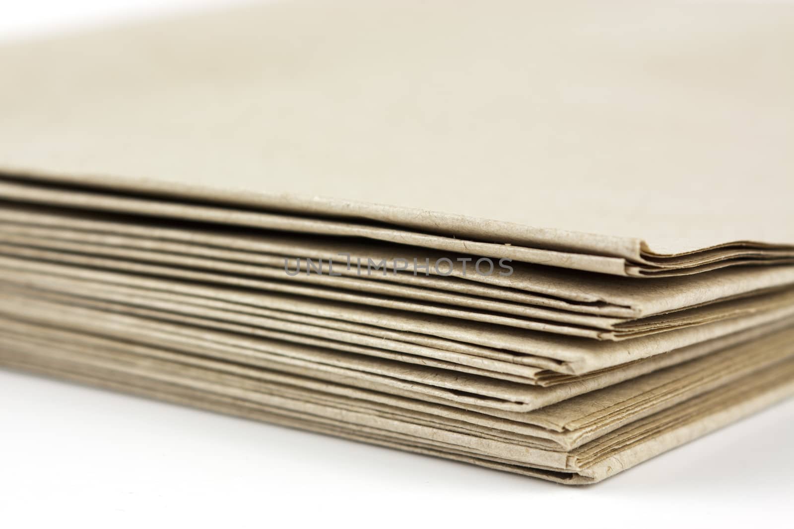 Stack of folded up brown parcel paper