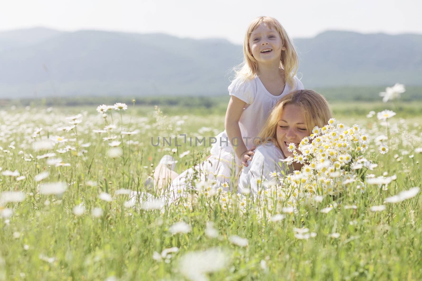 Family in the flower field by alenkasm