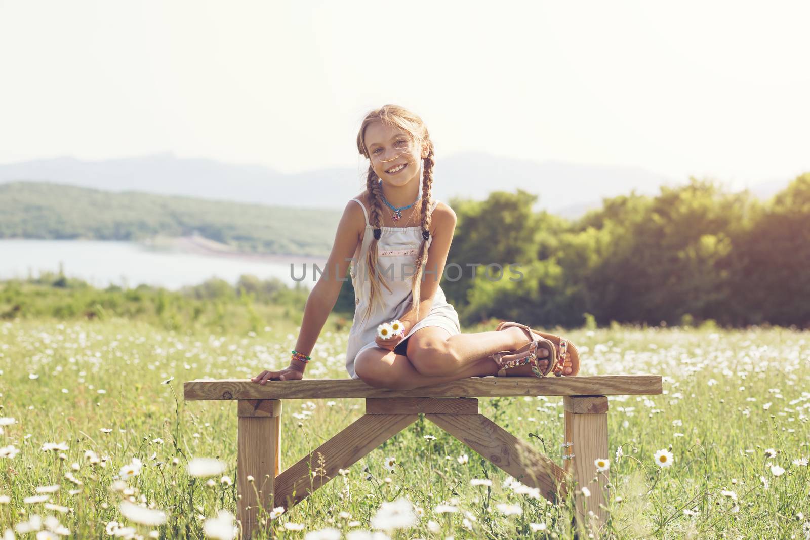 Little girl in flower field by alenkasm