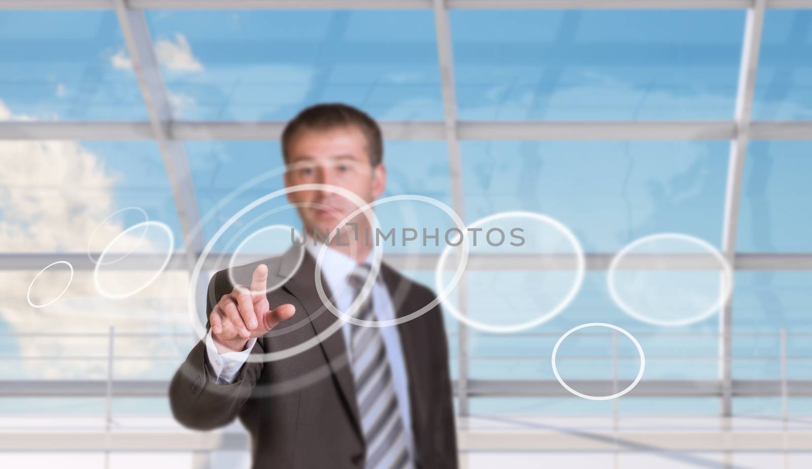 Businessman pressing on holographic screen on window and map background