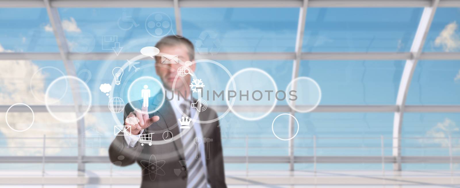 Businessman pressing on holographic screen by cherezoff