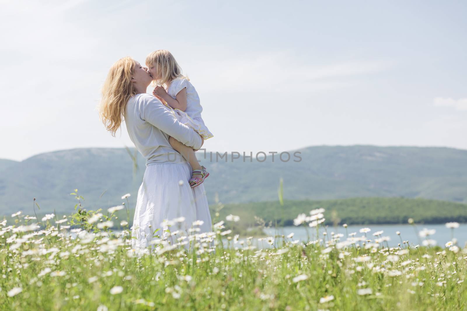 Family in the flower field by alenkasm