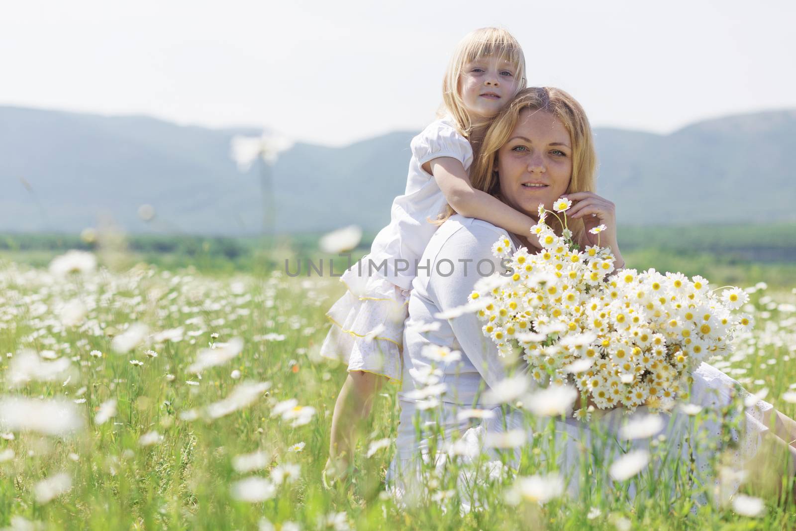Family in the flower field by alenkasm