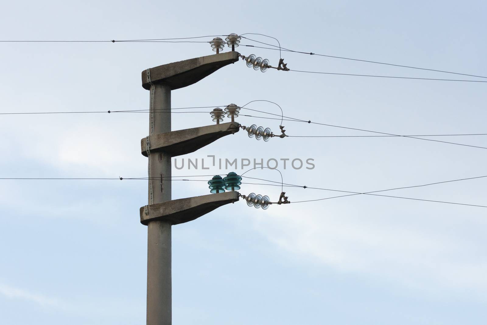 Electrical wire on pole. chaotic wire with nest on pole and blue sky background