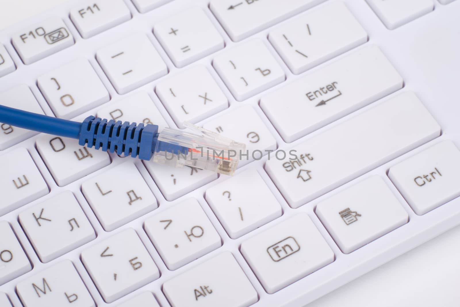 Computer keyboard with blue cable, close up view