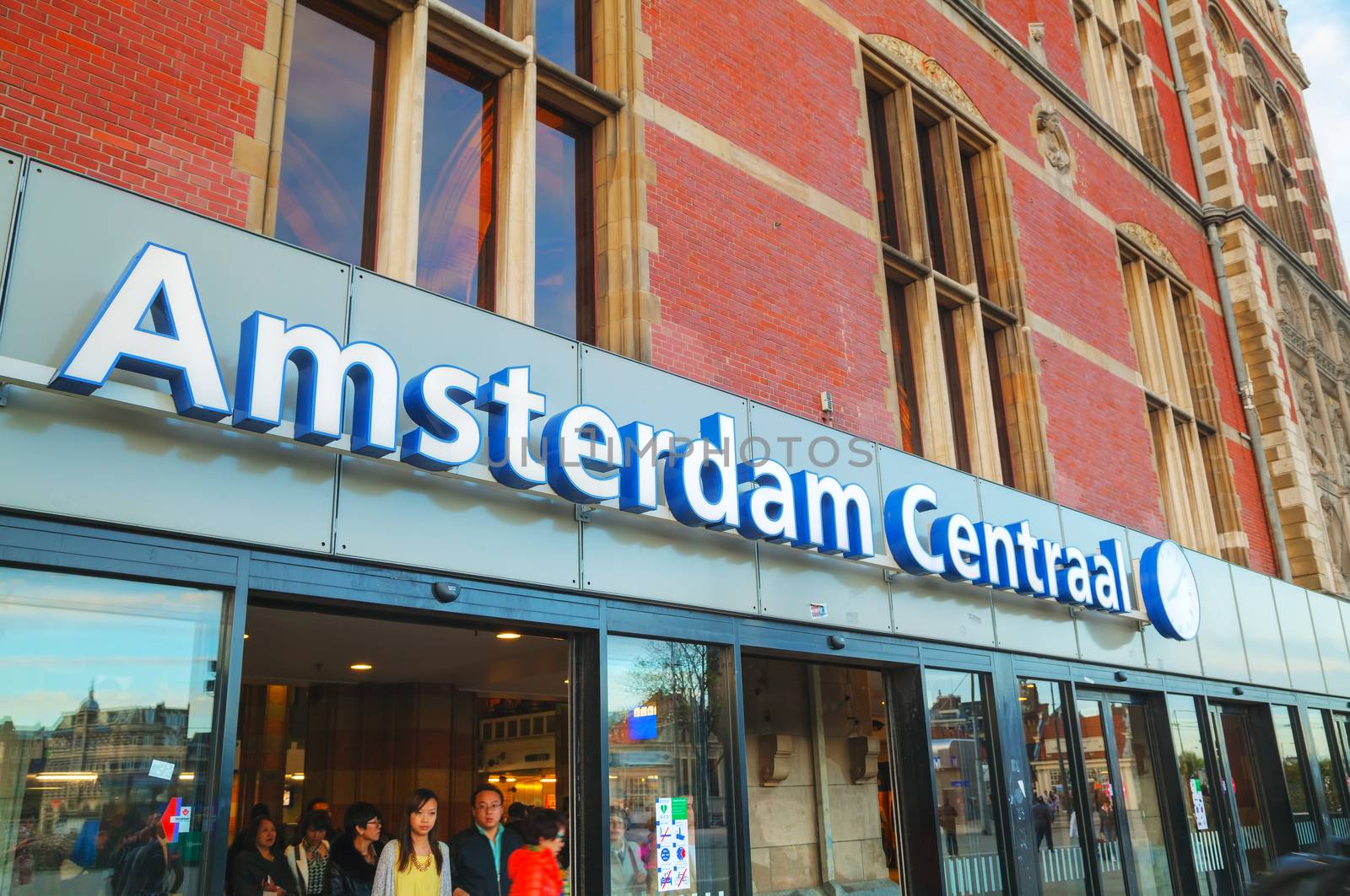 AMSTERDAM - APRIL 16: Entrance to the Amsterdam Centraal railway station on April 16, 2015 in Amsterdam, Netherlands. It's is the largest railway station of Amsterdam and a major national railway hub.