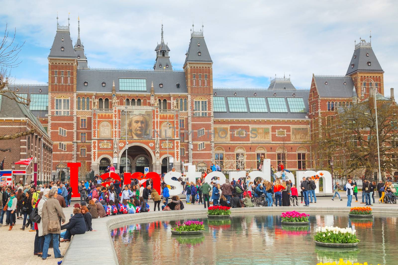 AMSTERDAM - APRIL 16: I Amsterdam slogan with crowd of tourists on April 16, 2015 in Amsterdam. Located at the back of the Rijksmuseum on Museumplein, the slogan quickly became a city icon.