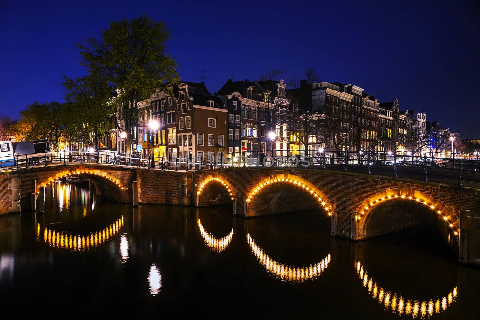 Night city view of Amsterdam by AndreyKr