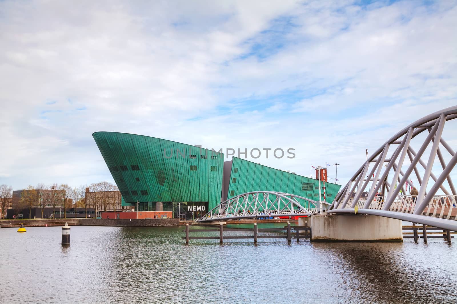 AMSTERDAM - APRIL 16: Science Center Nemo building on April 16, 2015 in Amsterdam, Netherlands. It contains five floors of hands-on science exhibitions and is the largest science center in the Netherlands.