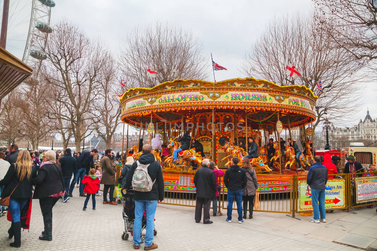 Carousel at the Thames riverbank in London by AndreyKr