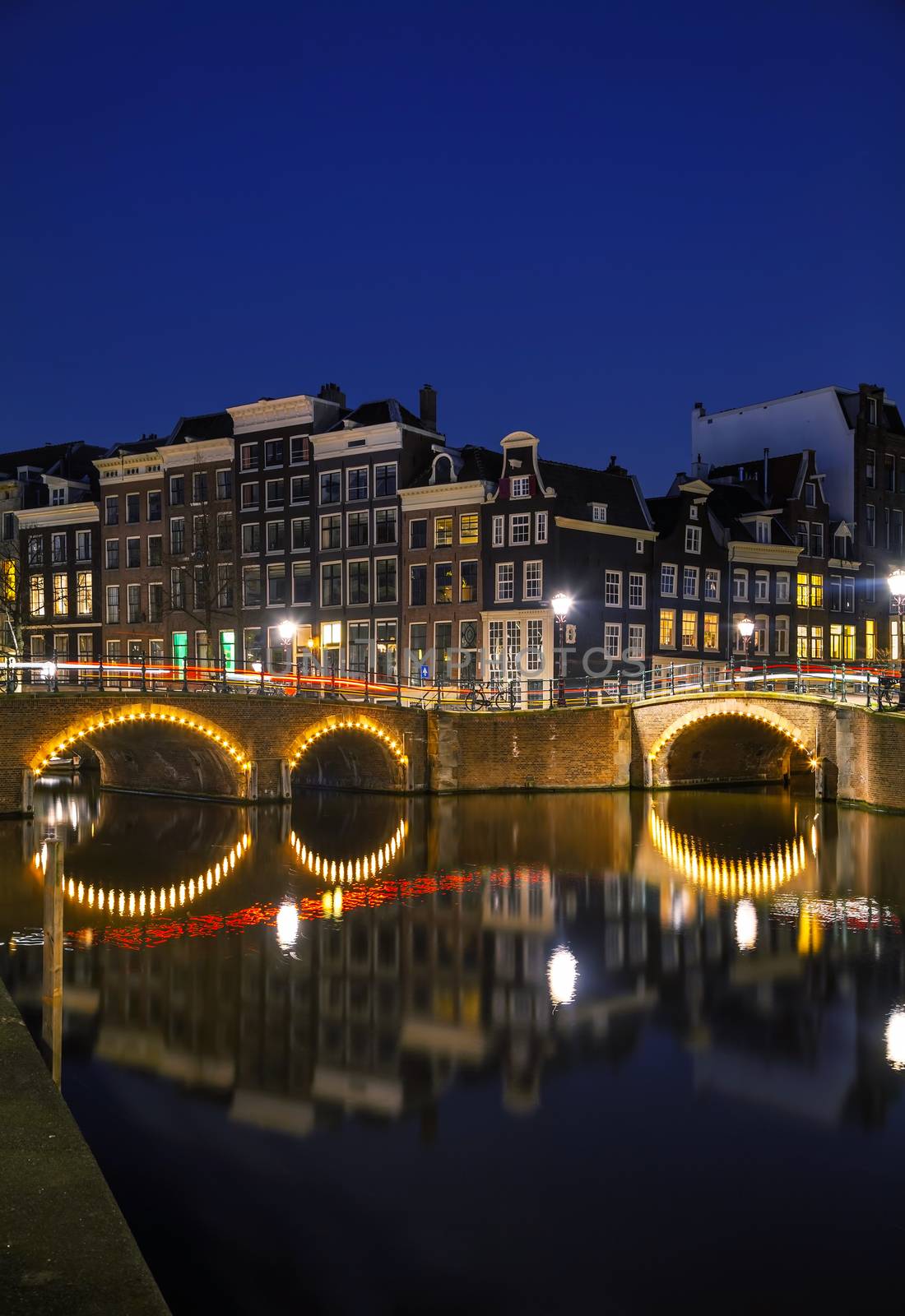 Night city view of Amsterdam, the Netherlands with a canal