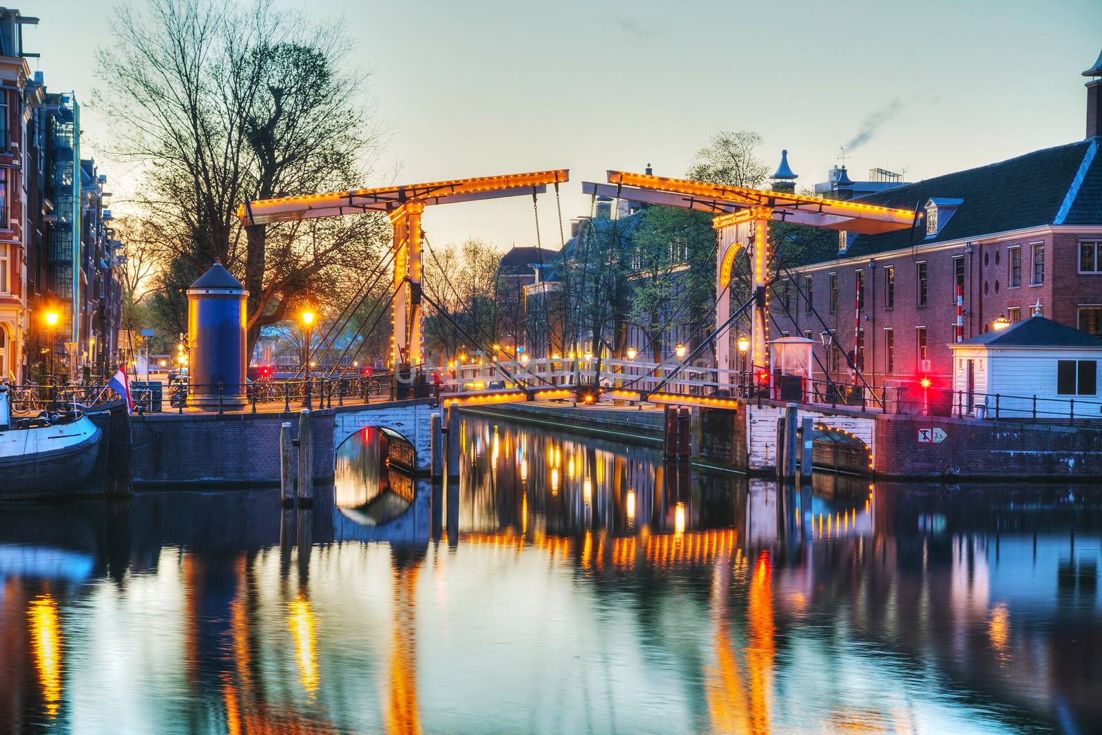 Night city view of Amsterdam, the Netherlands with Amstel river