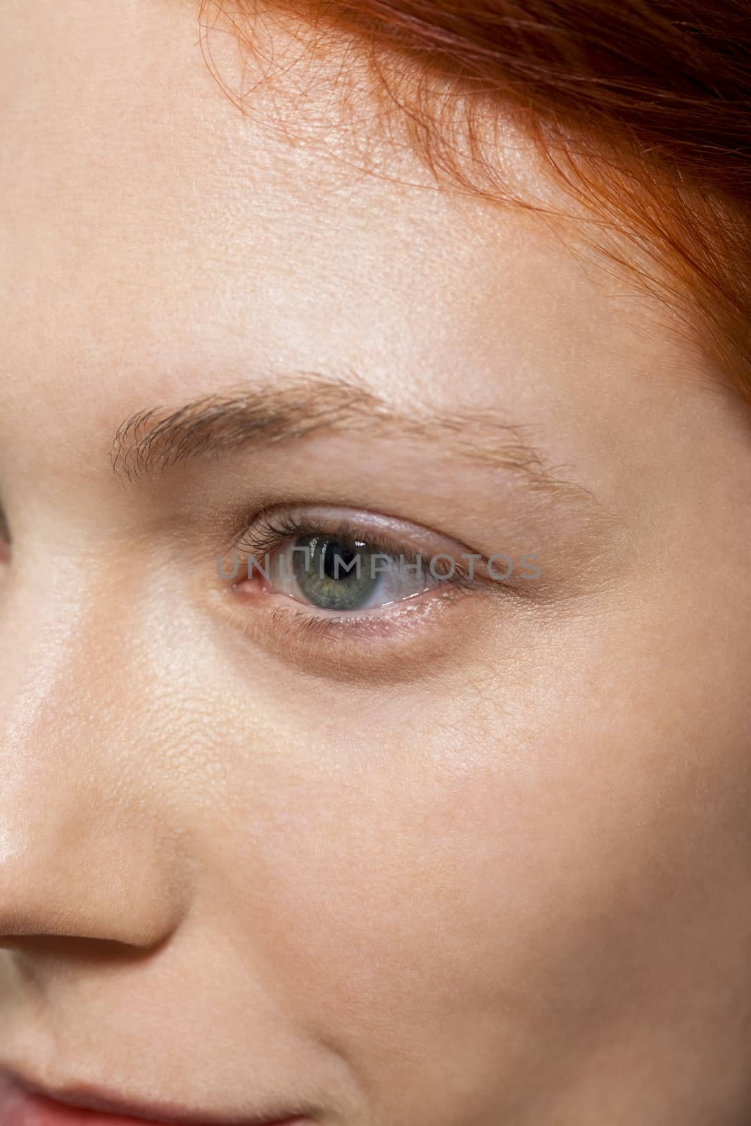 Conceptual Close up Gray Eye of a Woman Looking Up