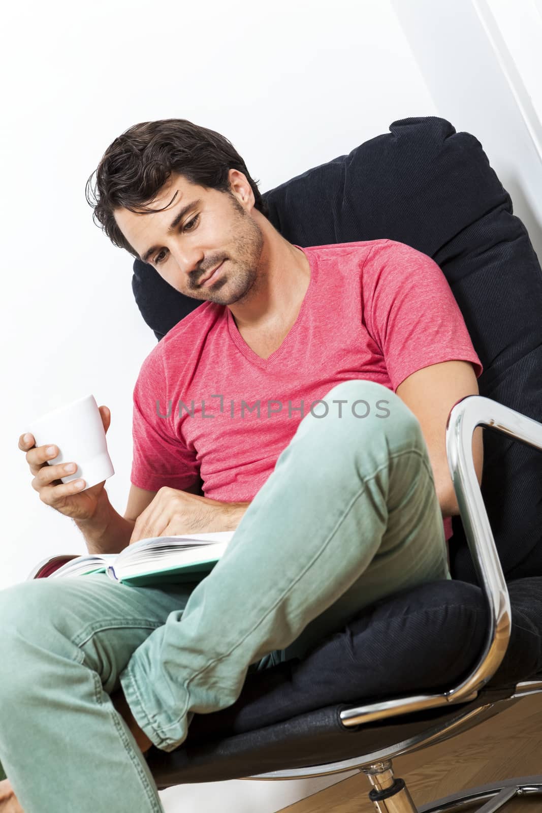 Man Sitting on Chair with Book and a Drink by juniart