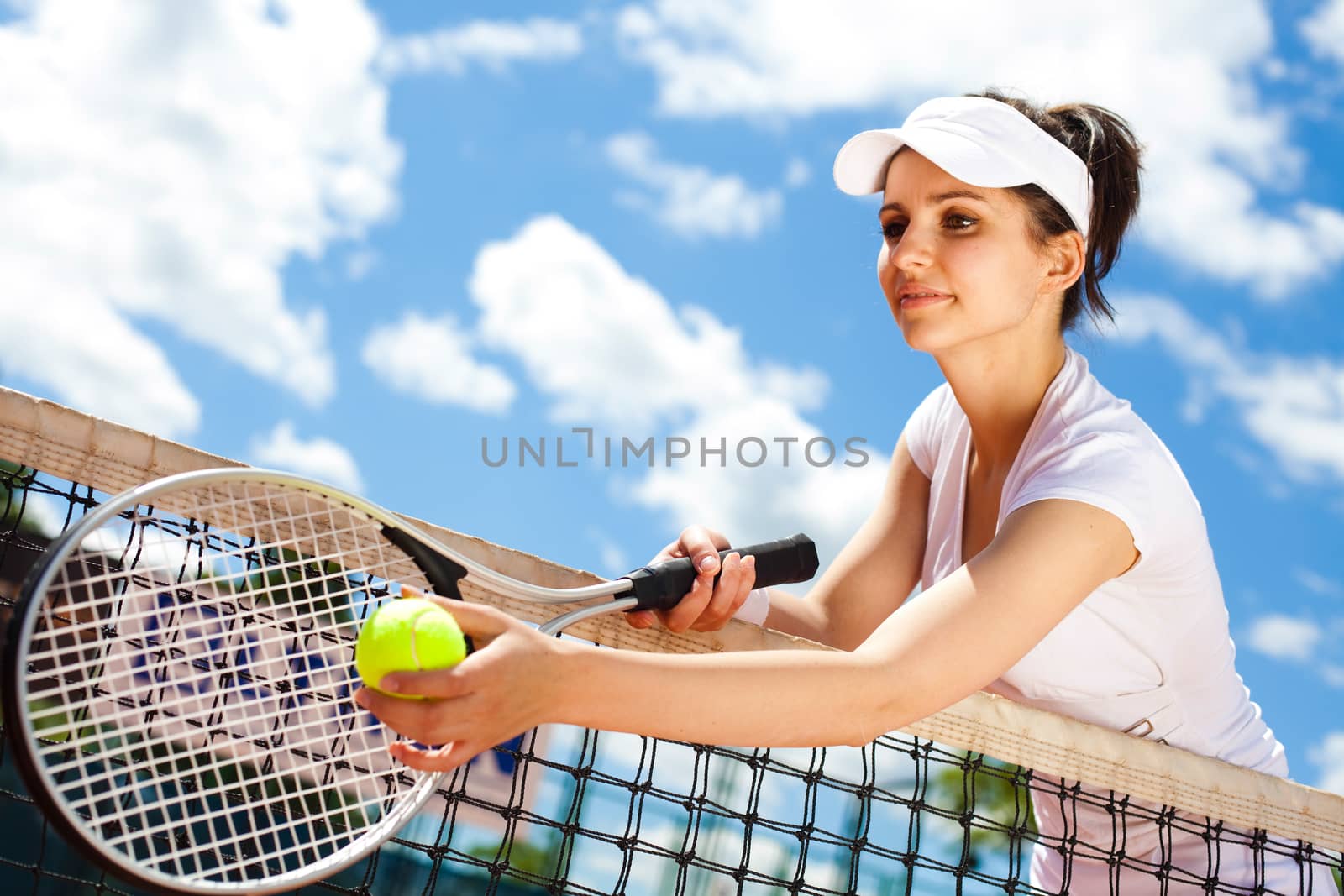 Playing tennis, summertime saturated theme