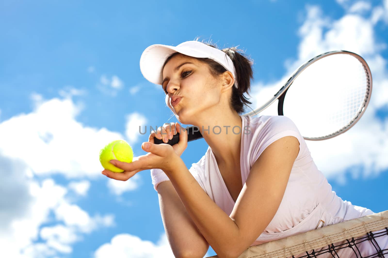 Woman playing tennis in summer