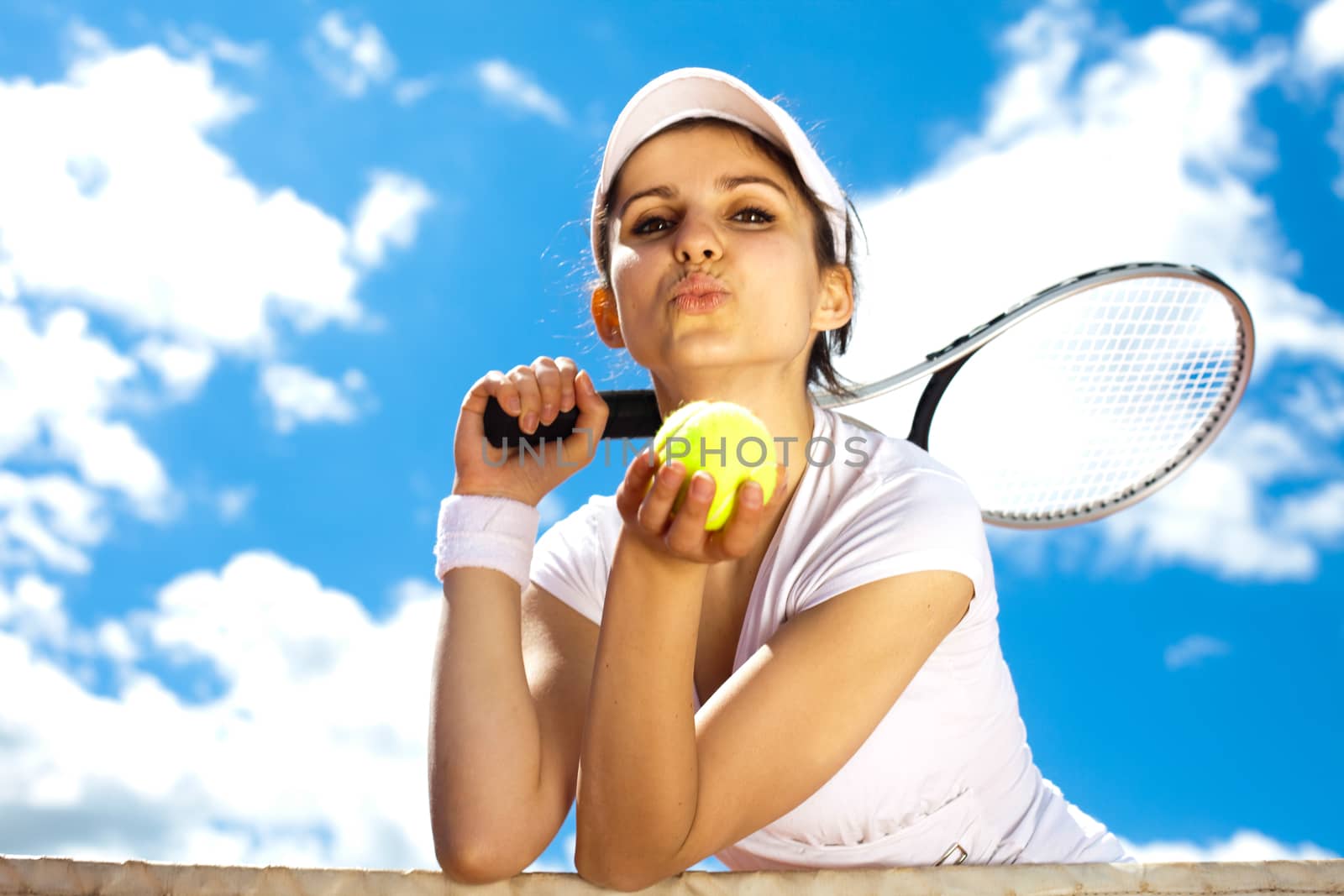 Woman playing tennis in summer