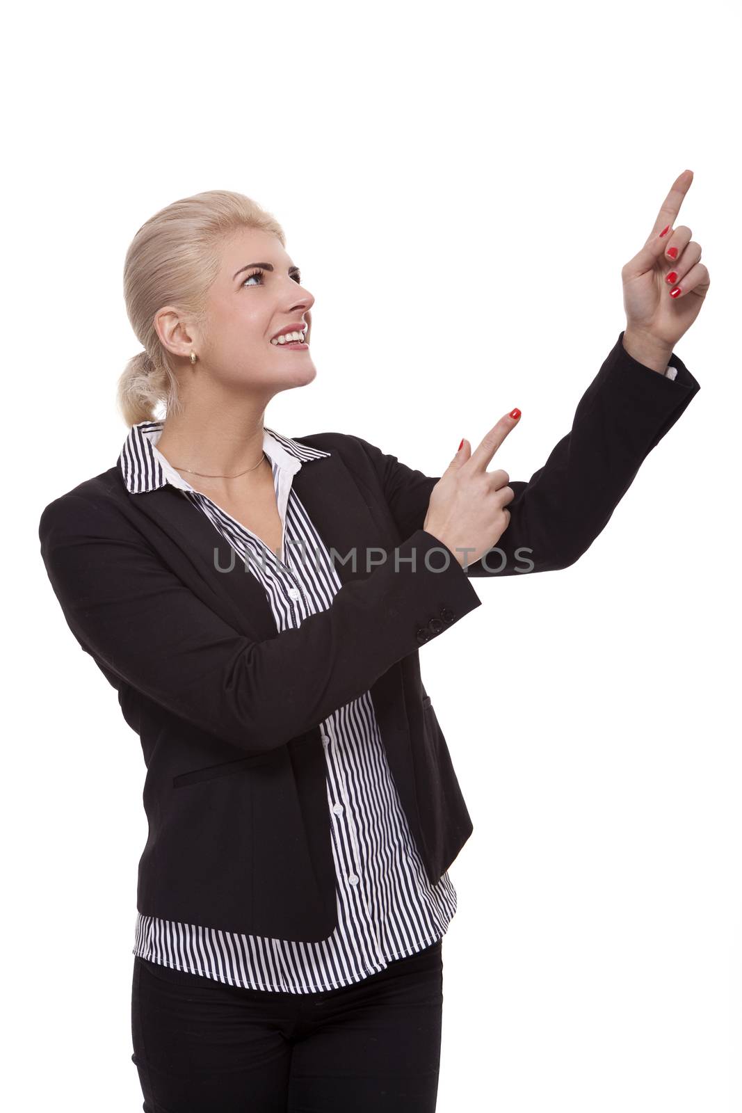 Close up Pretty Smiling Young Businesswoman Pointing Up with her Two Hands While Looking at the Camera. Isolated on White Background.