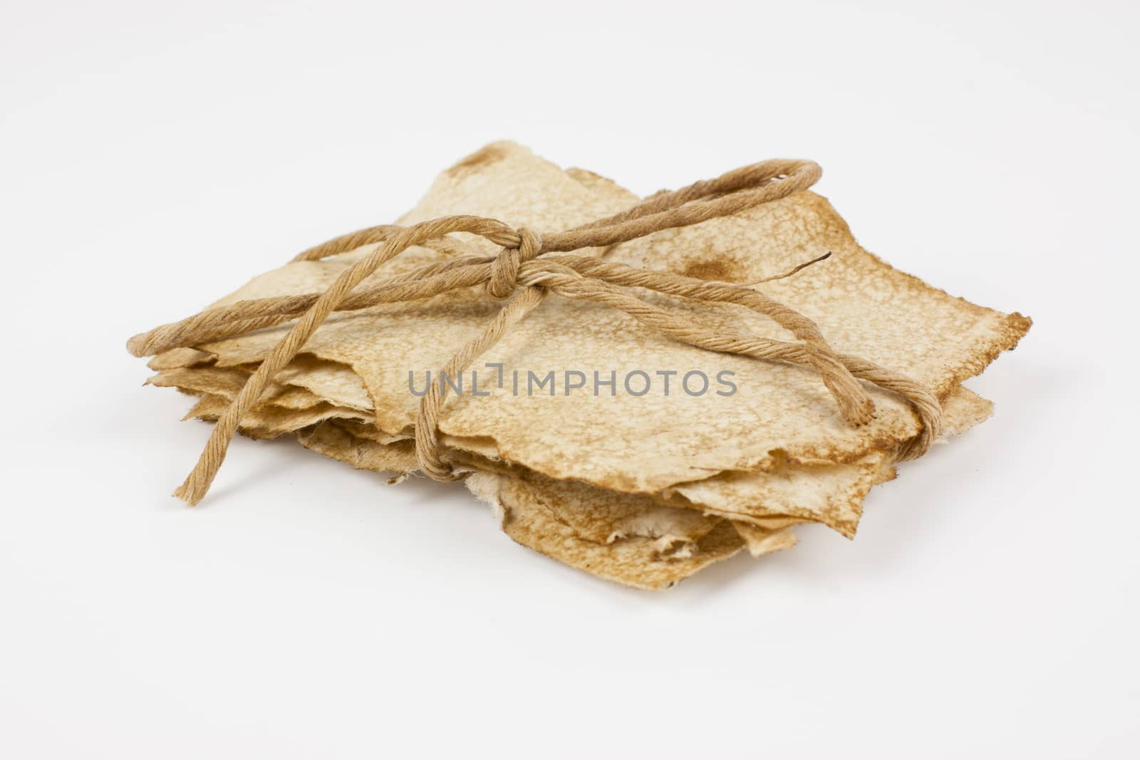 Bundle of old paper wrapped up and tided with string