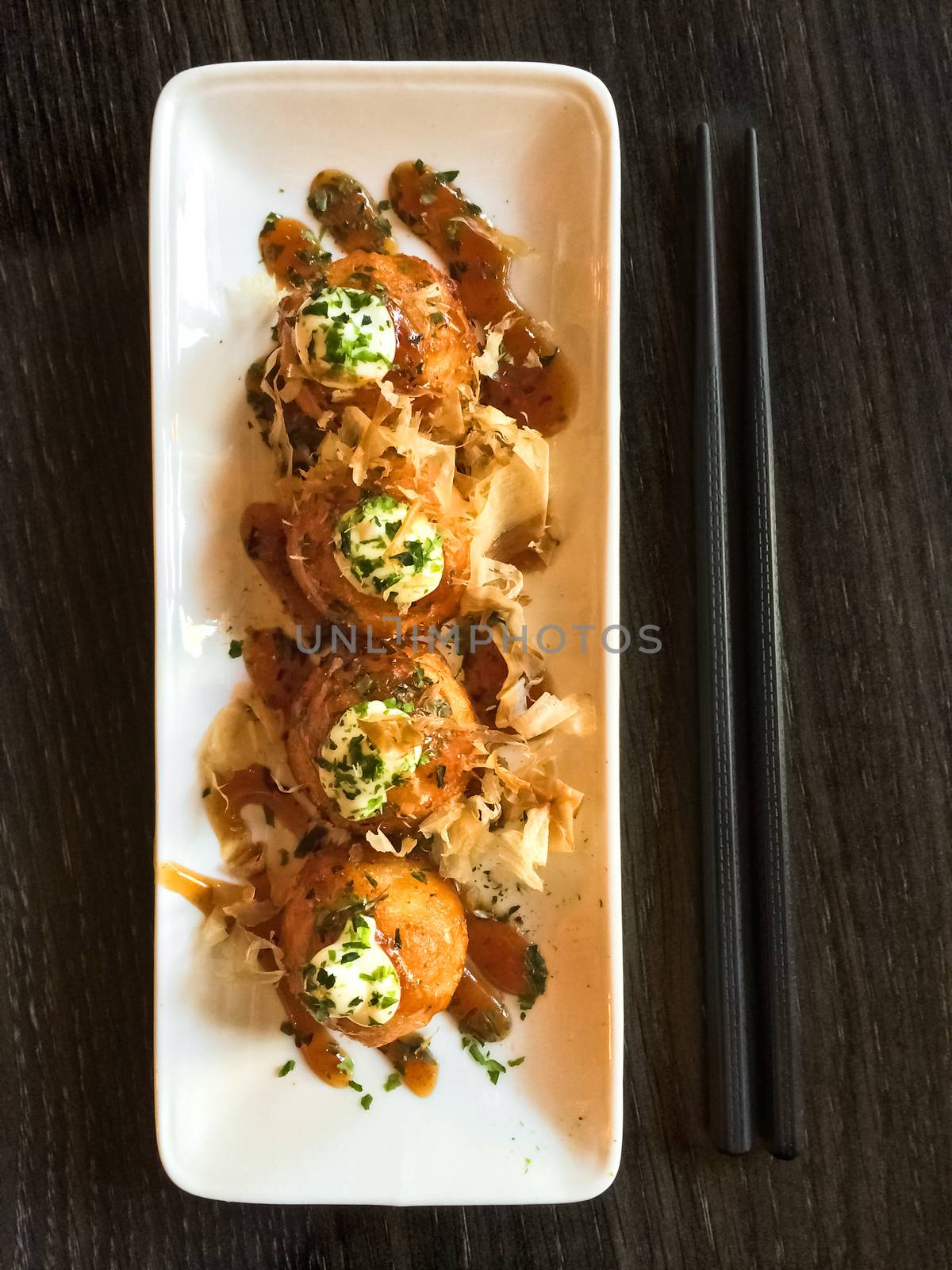 Takoyaki, creamy octopus balls. Japanese tapas, traditional cuisine.