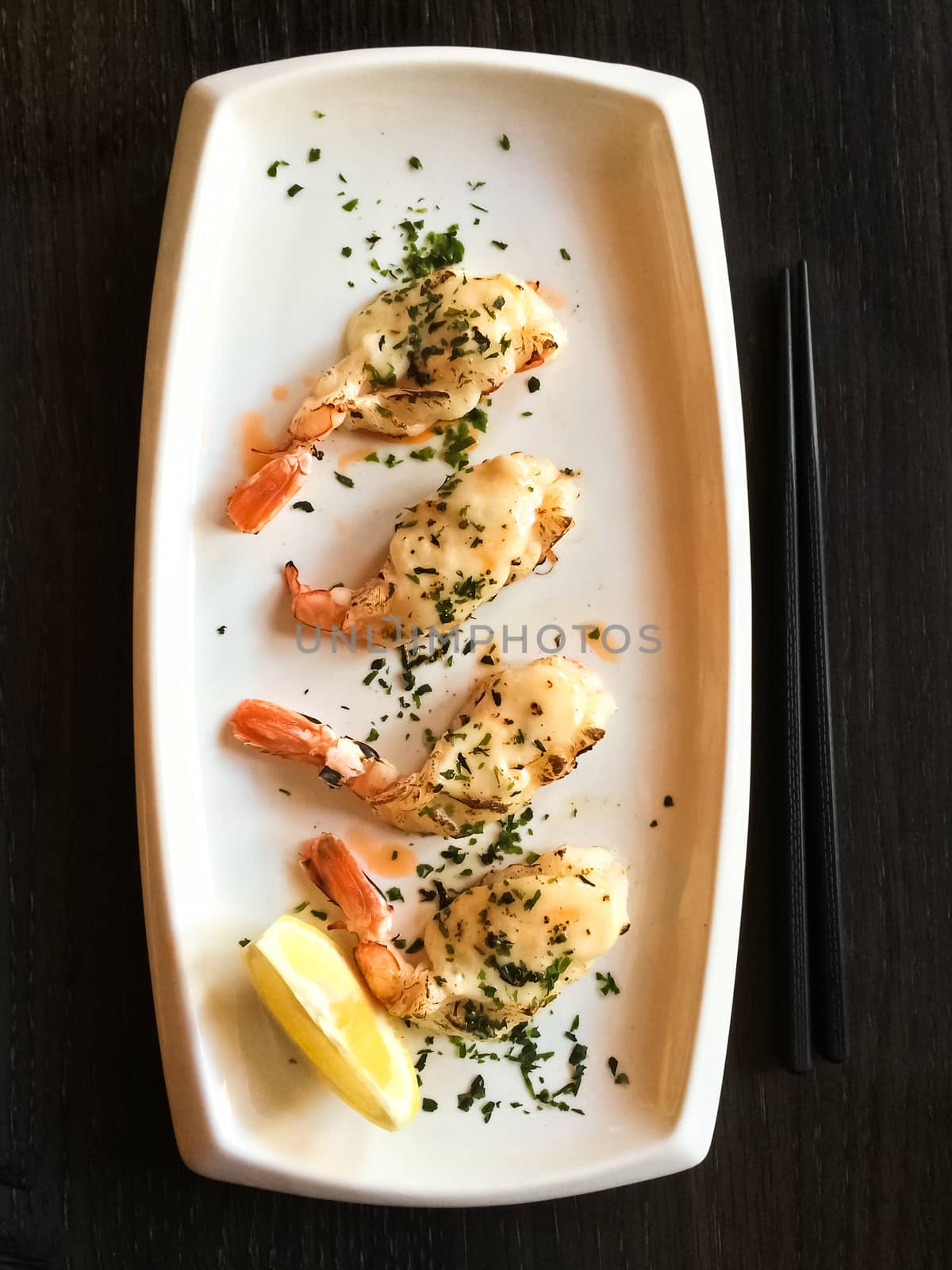 White plate with grilled shrimps. Japanese tapas, traditional cuisine.