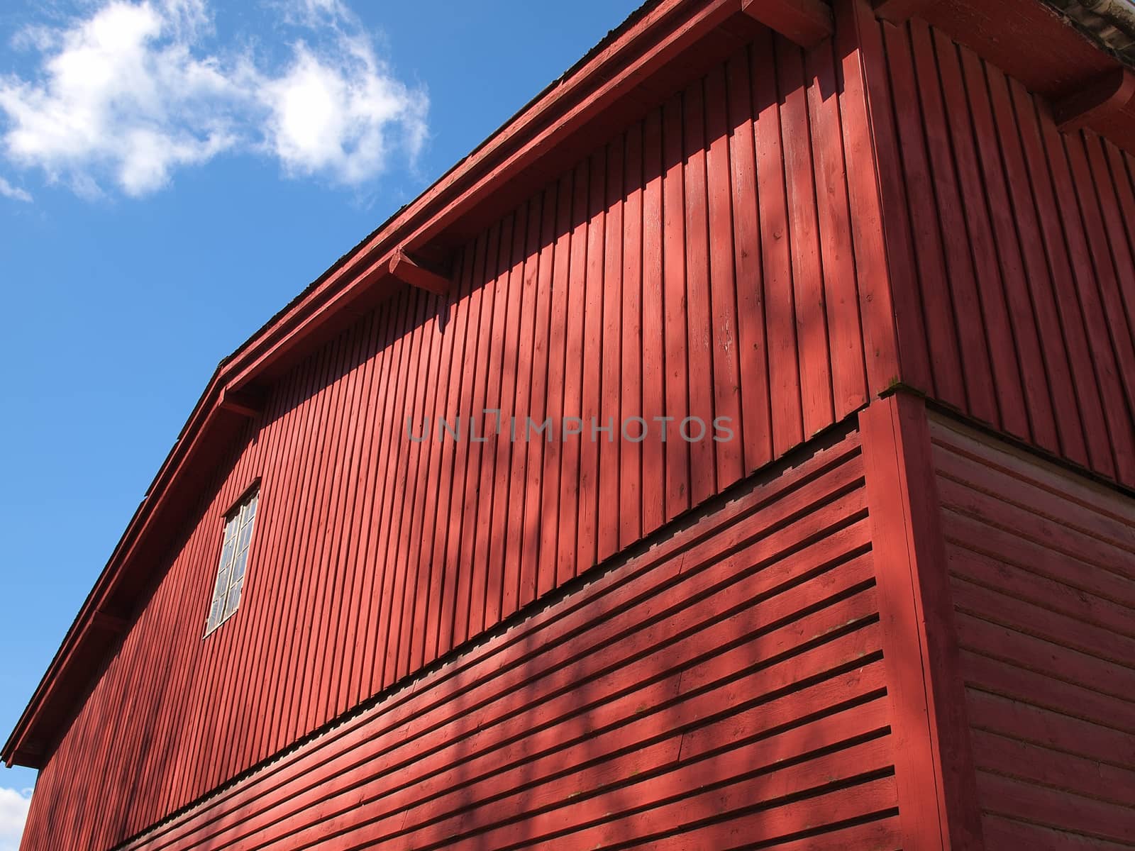 Red old vintage barn in a farm agriculture background image         