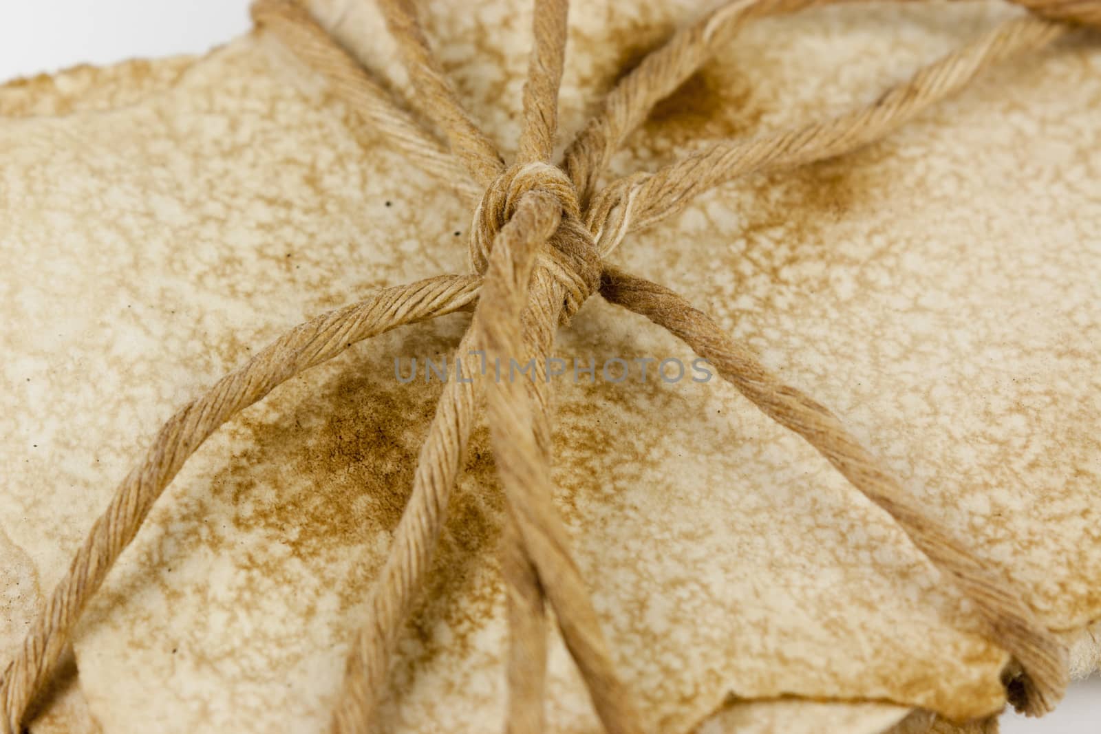 Bundle of old paper wrapped up and tided with string