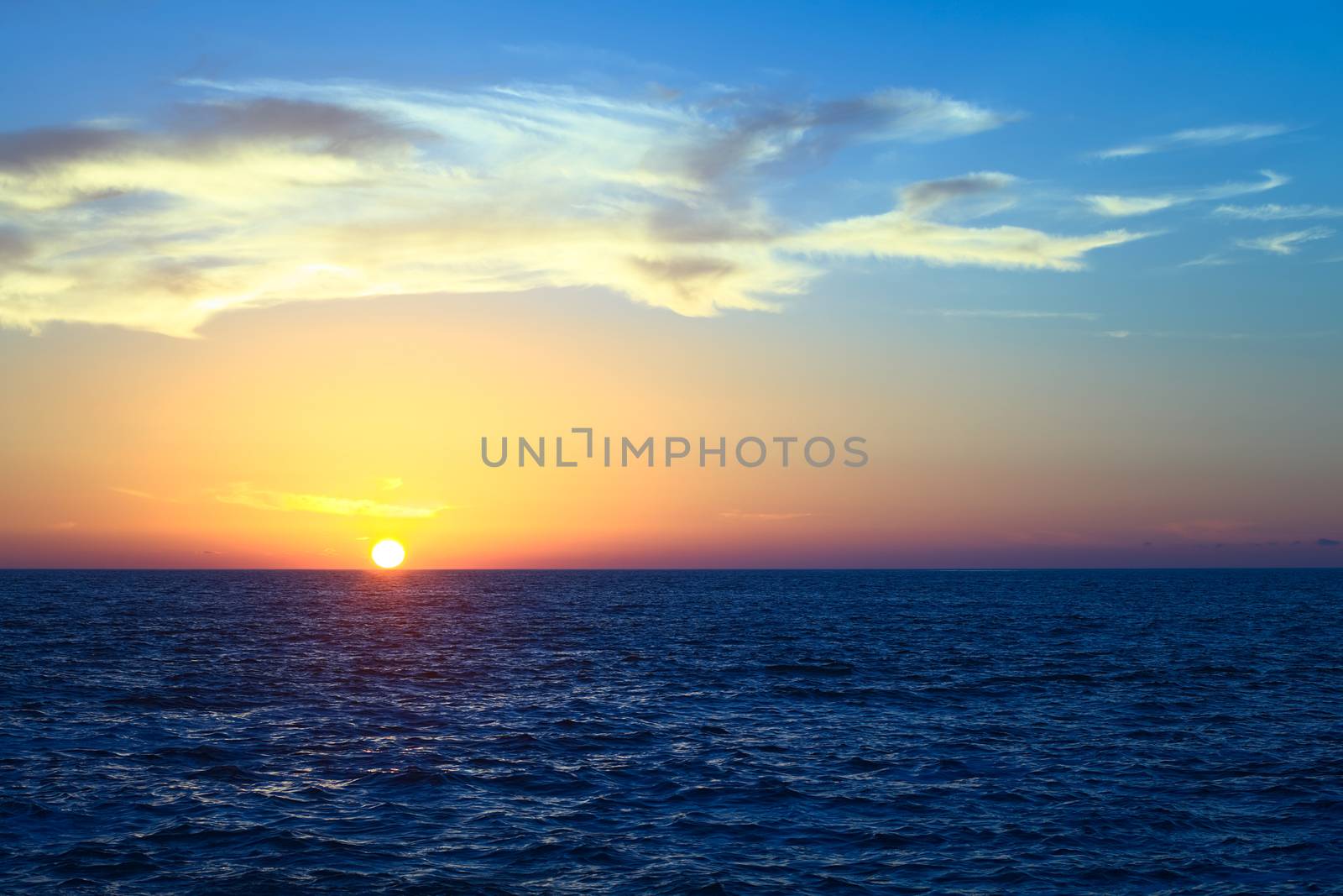 Sunset over the Pacific ocean viewed from Cavancha beach in Iquique, Chile. Iquique is a popular beach town and free port city in Northern Chile. 