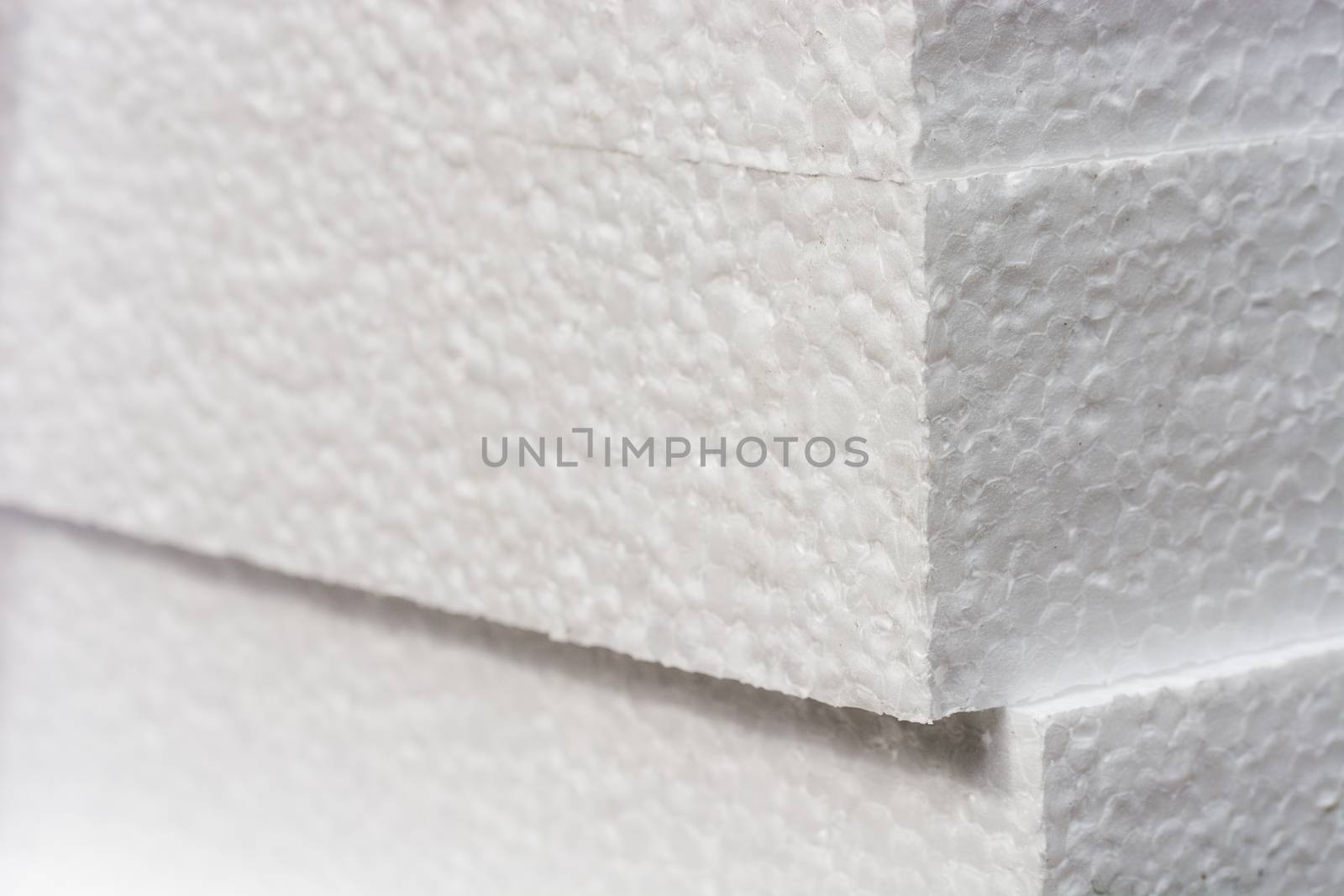 Polystyrene insulation boards background with copyspace and accented sharpness on edges