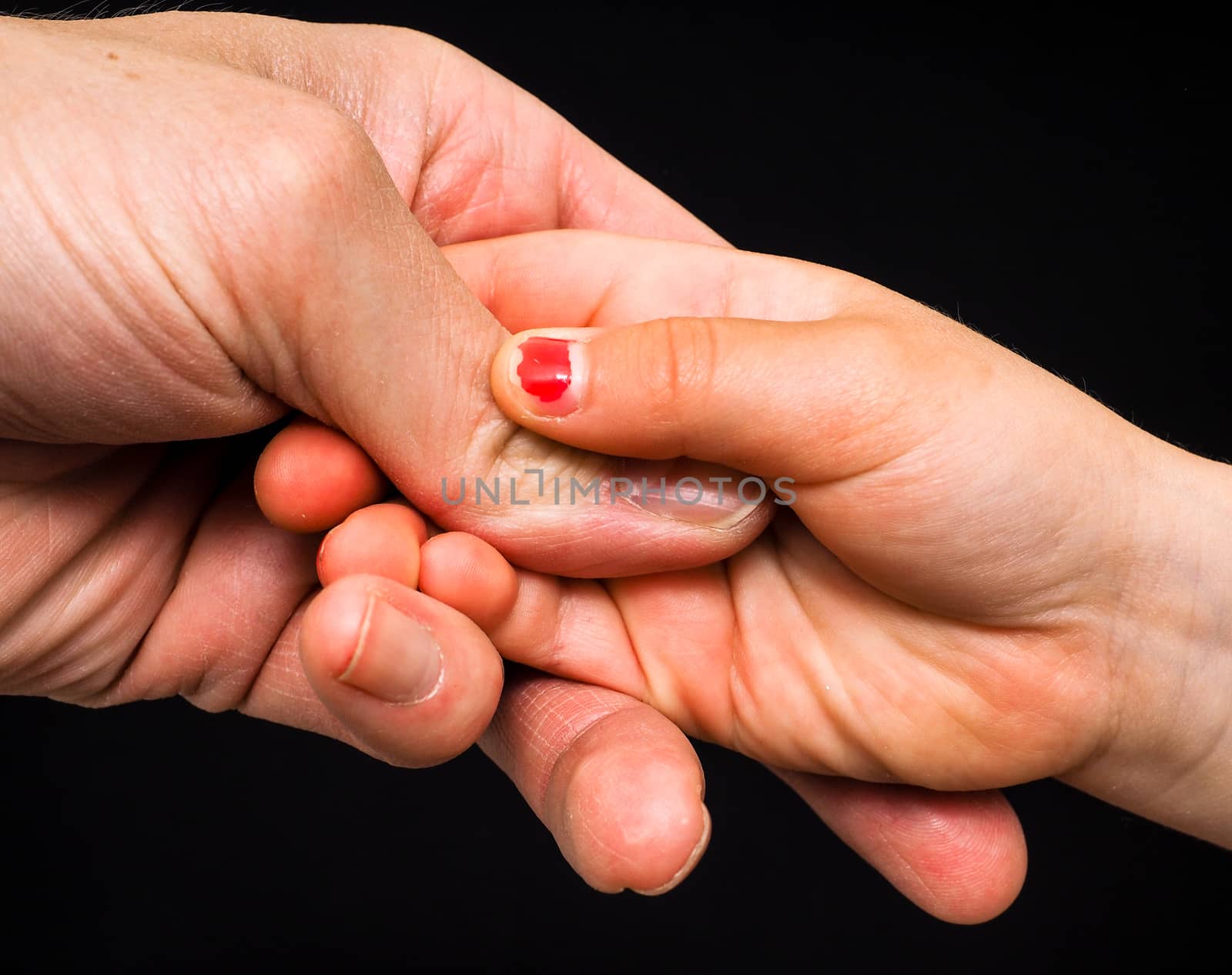 Daughter connecting with fathers hand by Arvebettum