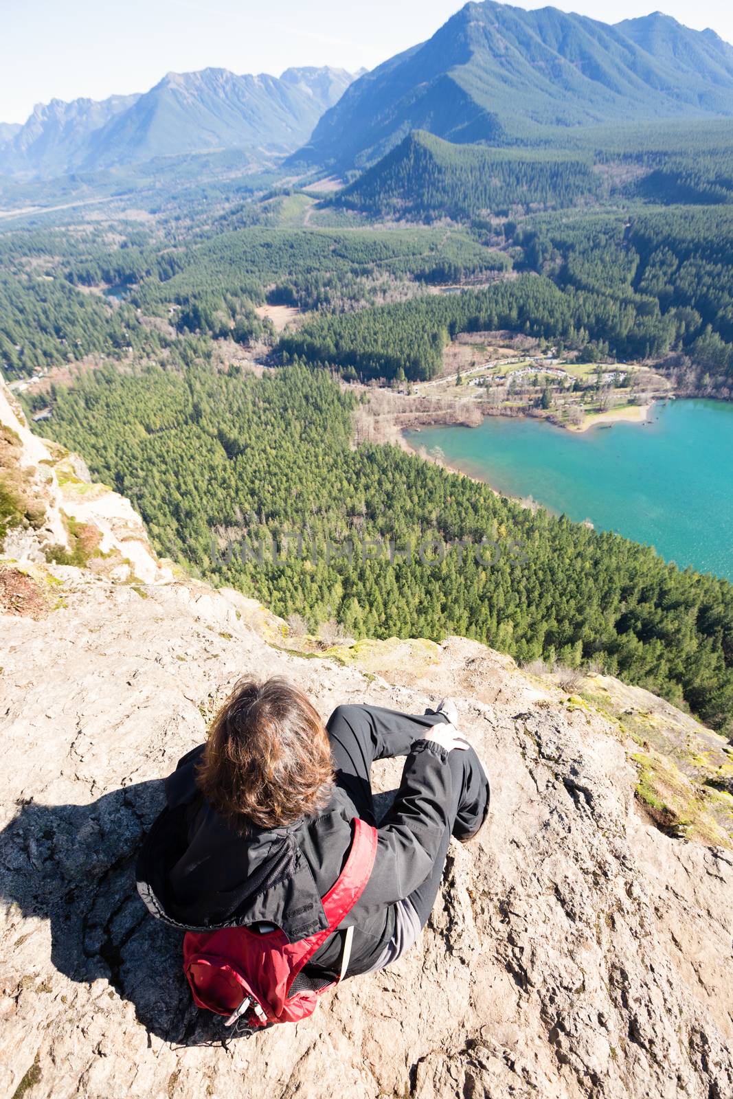 Woman enjoying rewarding view of  Rattlesnake Ledge Trail by coskun