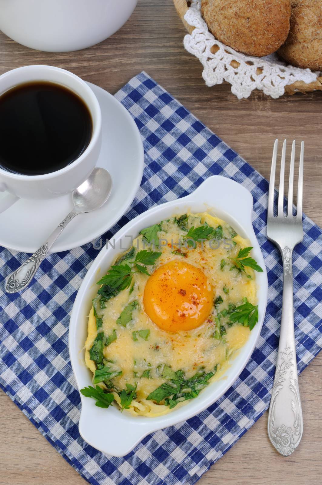 baked spinach and cheese with egg yolk cup of coffee