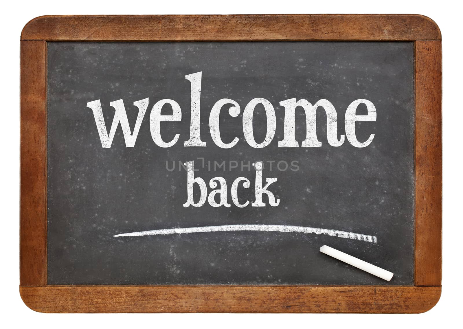 Welcome back sign - text on a vintage slate blackboard