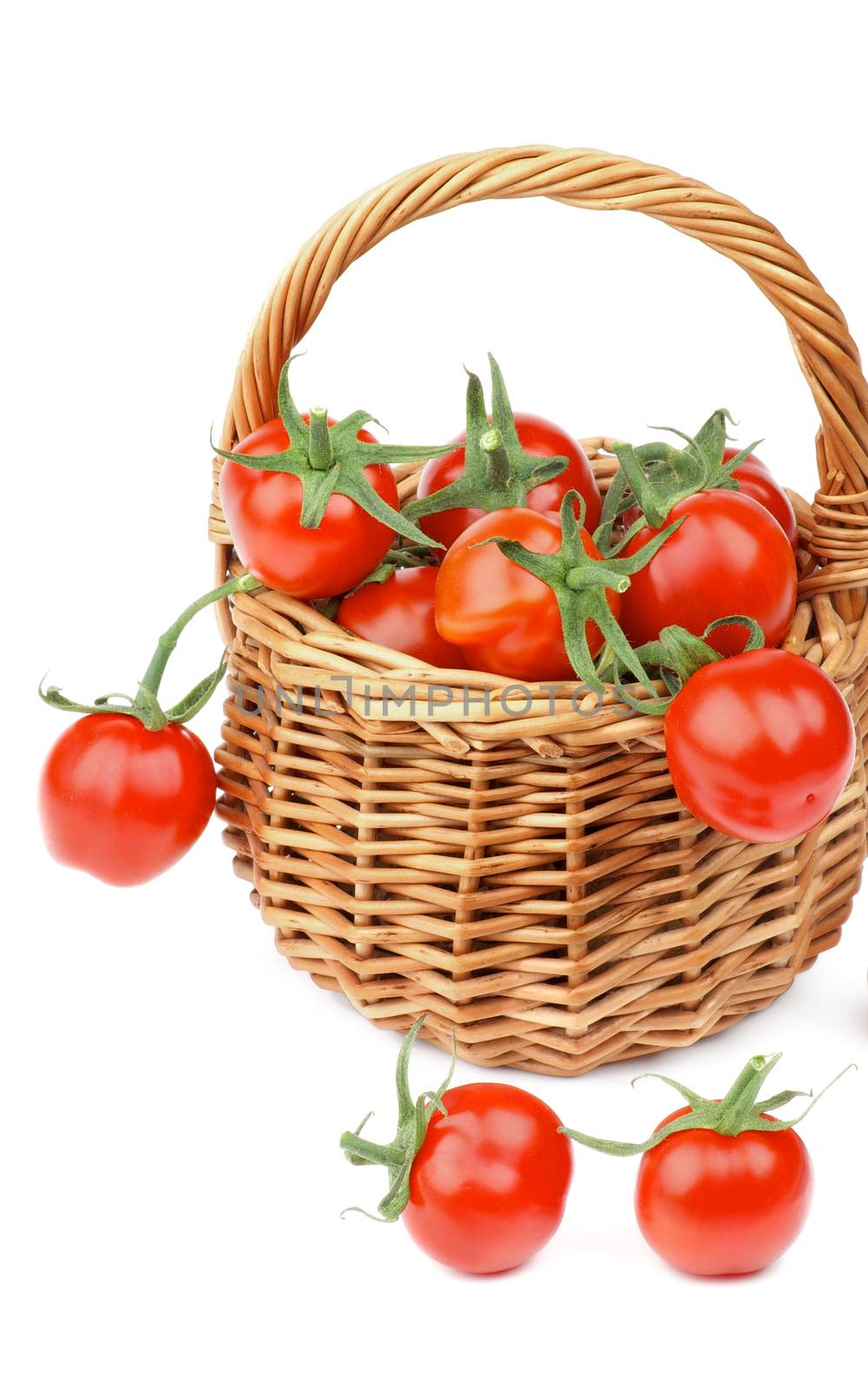 Wicker Basket with Perfect Ripe Cherry Tomatoes with Stems closeup on white background