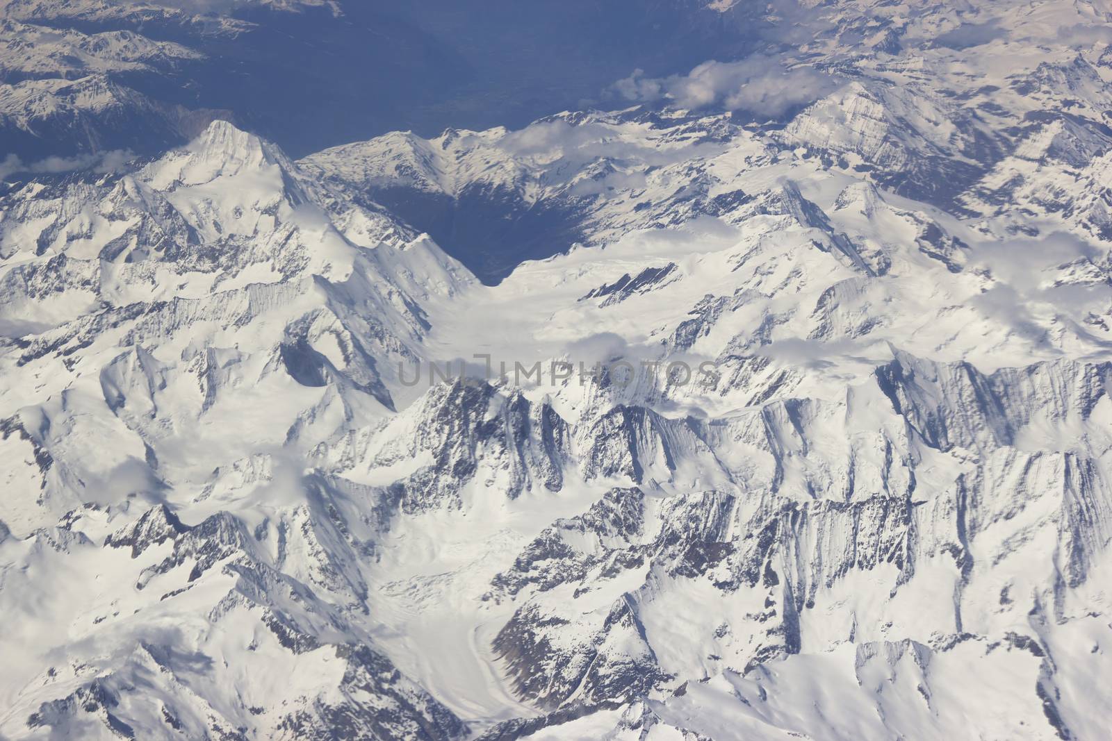 Alps - aerial view from window of airplane by miradrozdowski