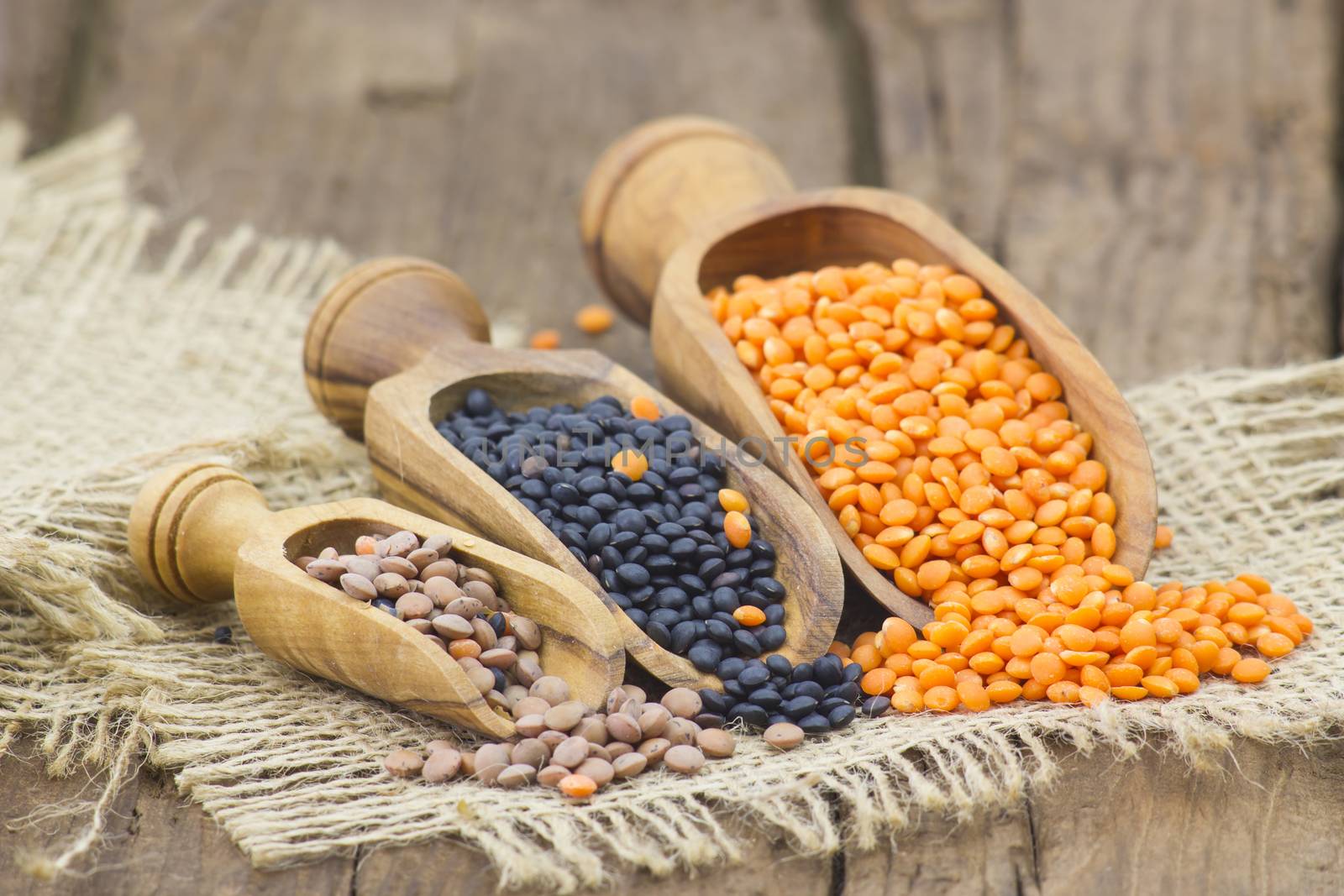 wooden scoops with lentils by miradrozdowski