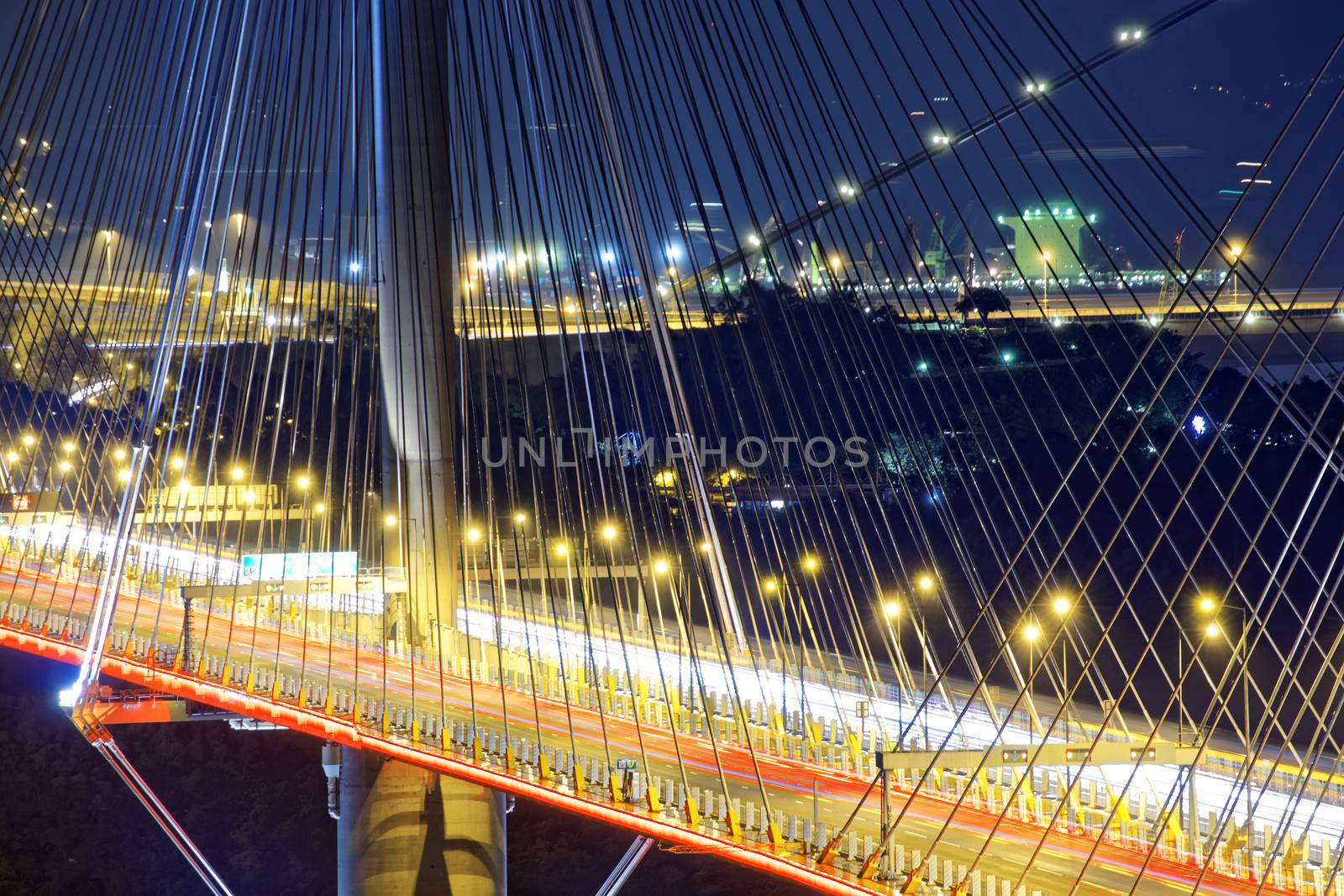 highway bridge at night with traces of light traffic, Ting Kau bridge at hong kong.