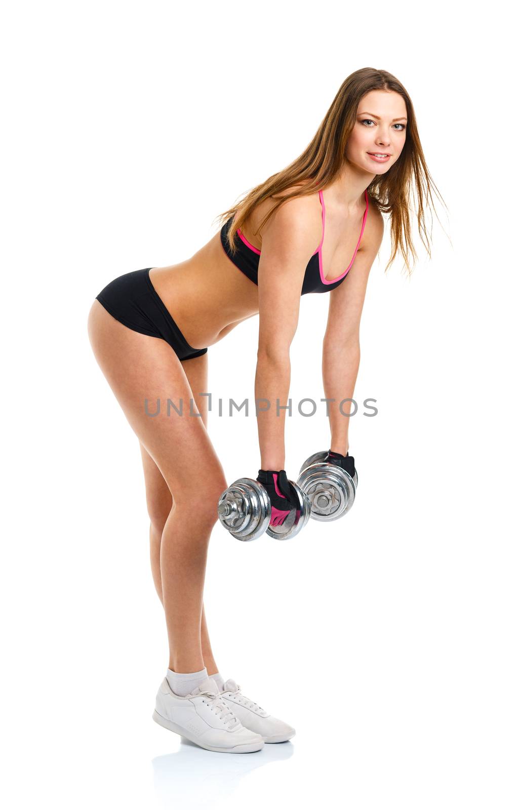 Happy athletic woman with dumbbells doing sport exercise, isolated on white background