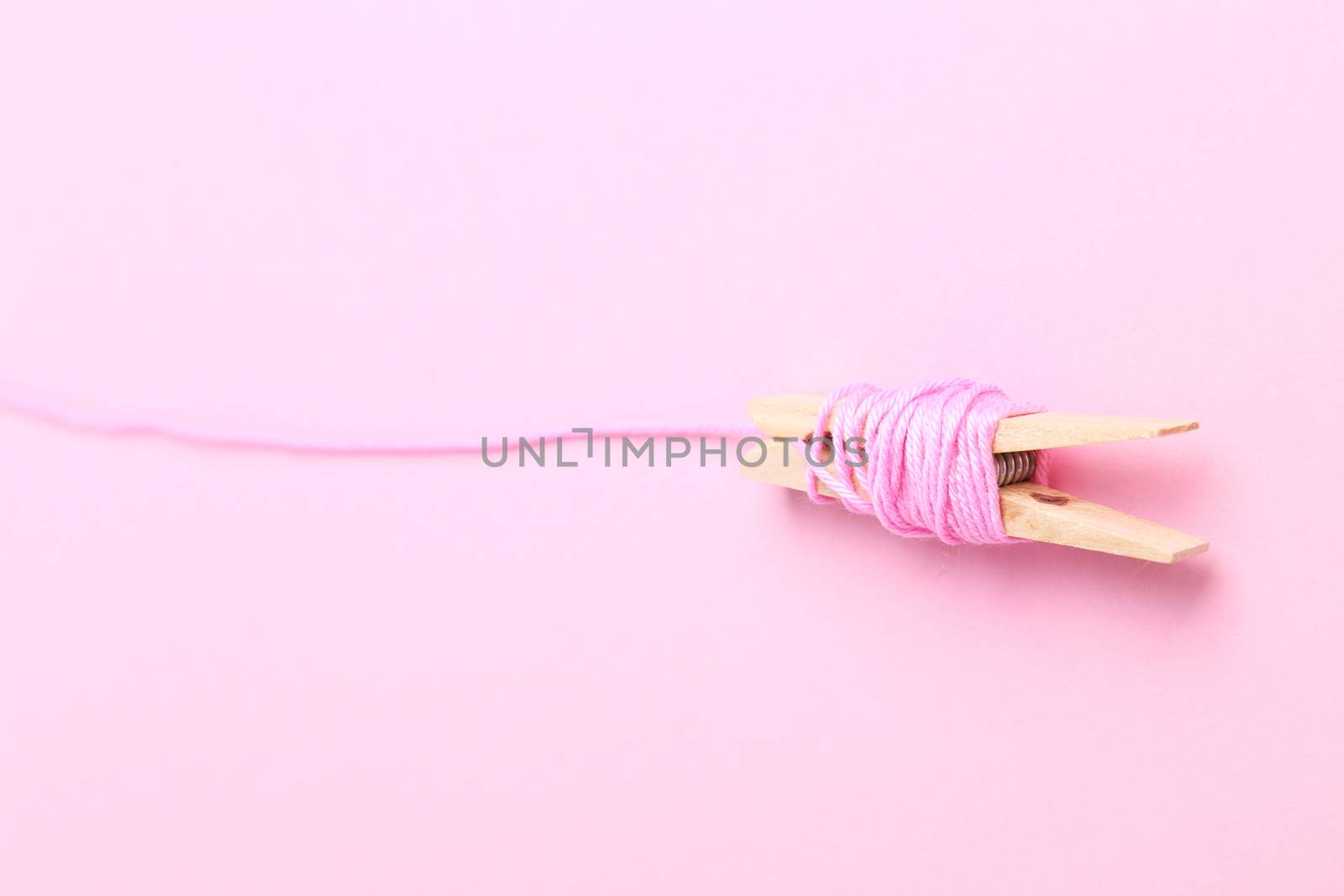 Threads on a pink background