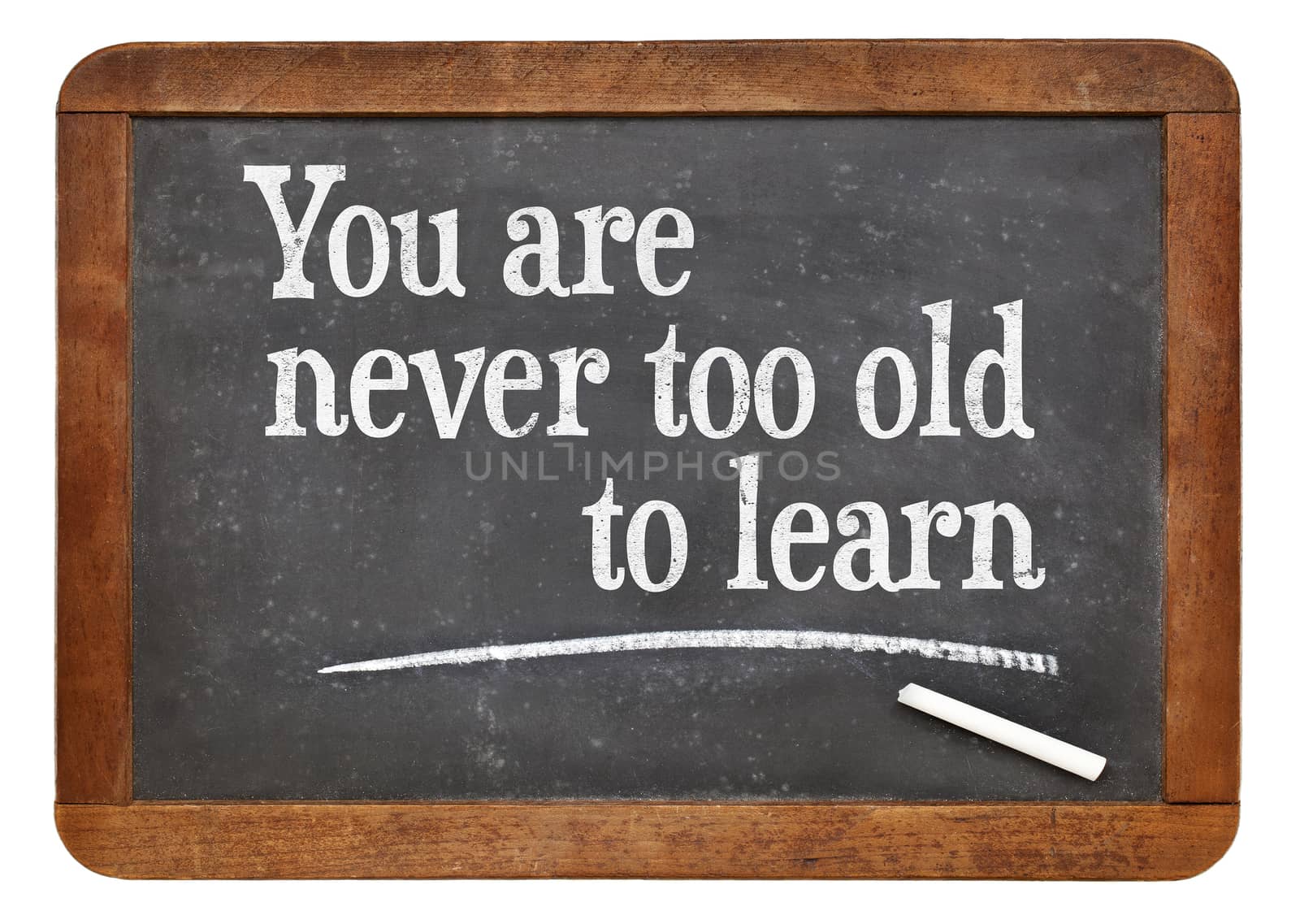 You are never too old too learn - motivational words  on a vintage slate blackboard -continuous education concept