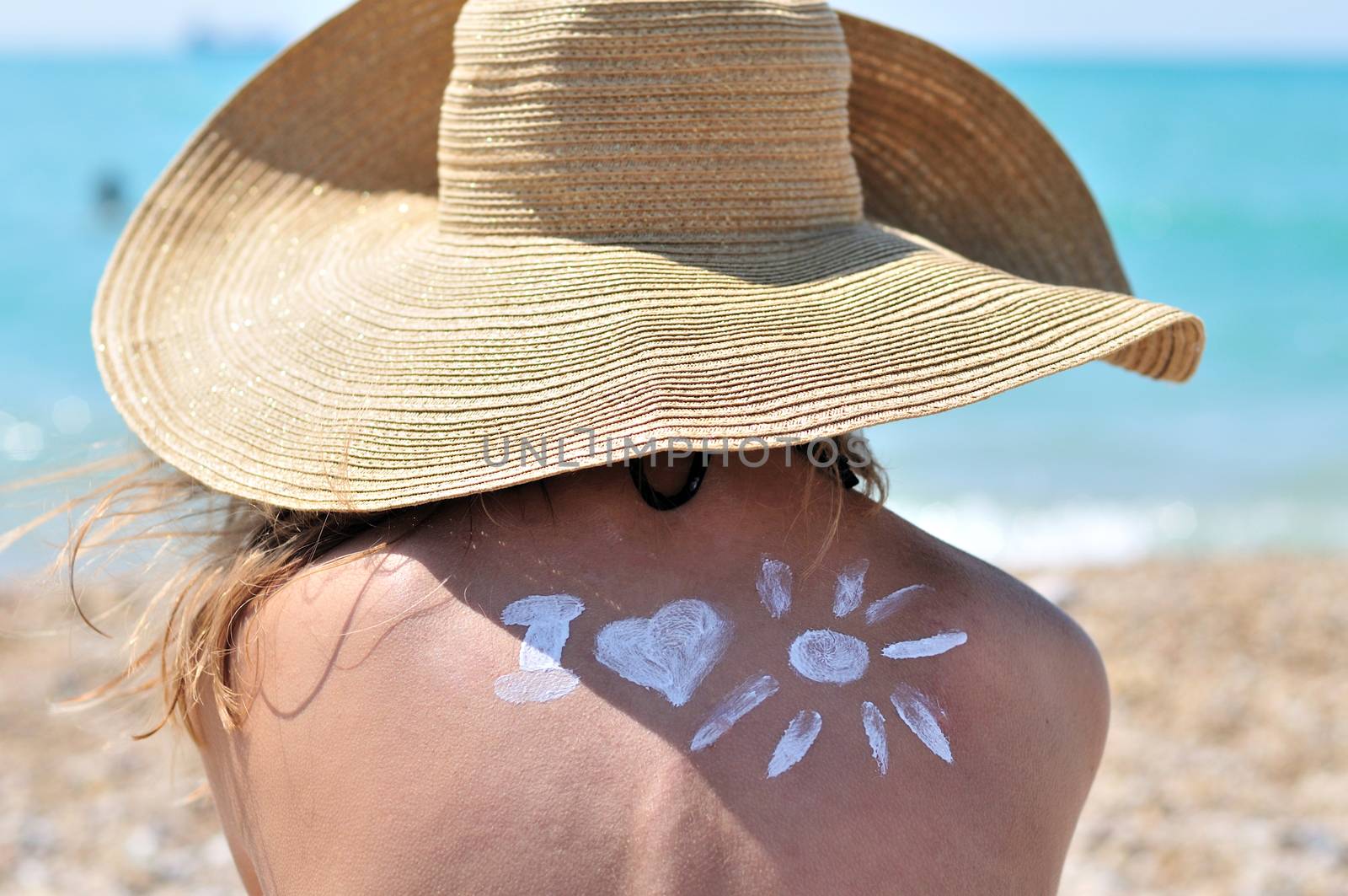 Sun Protection, girl using sunscreen  to safe her skin healthy